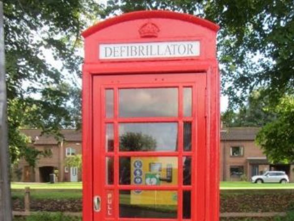 Telephone box in centre of village which has been restored as a defibrillator