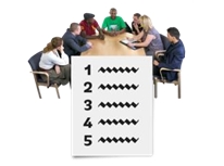 Group of people around a table with a list in front