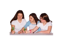 Three girls writing on paper together