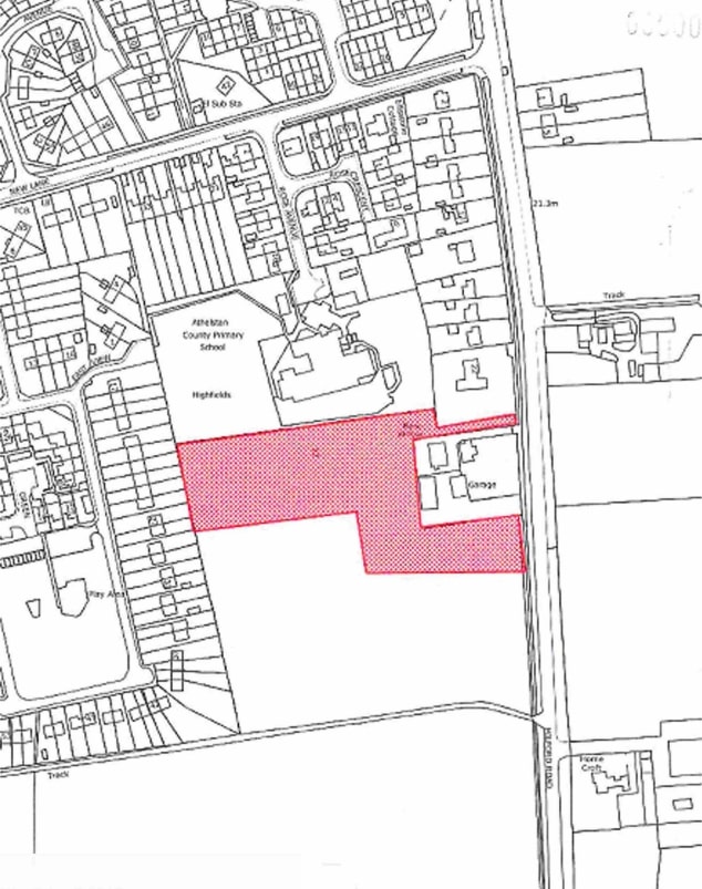Map of area from a birds eye view, with the boundary of land highlighted in red.