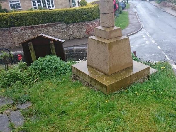 War memorial in small village before refurbishment