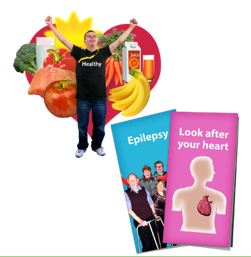 A person with fruit and vegetables and some healthy leaflets