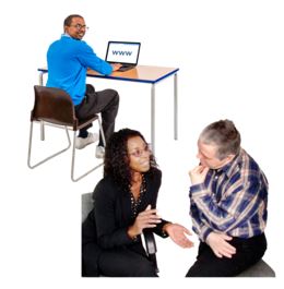 Two people talking a one person sat at a desk with a laptop