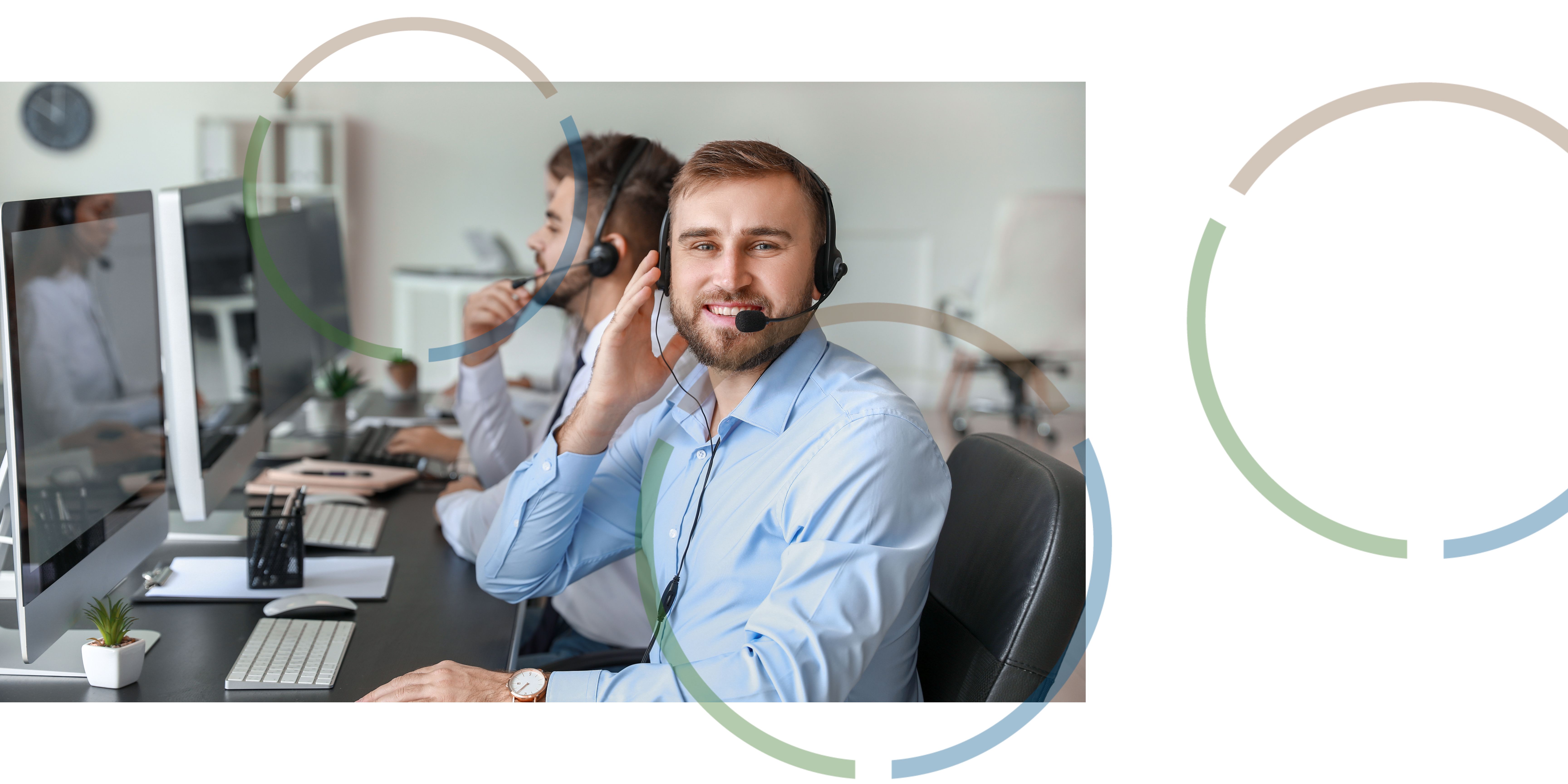 People working at computers wearing headsets. 