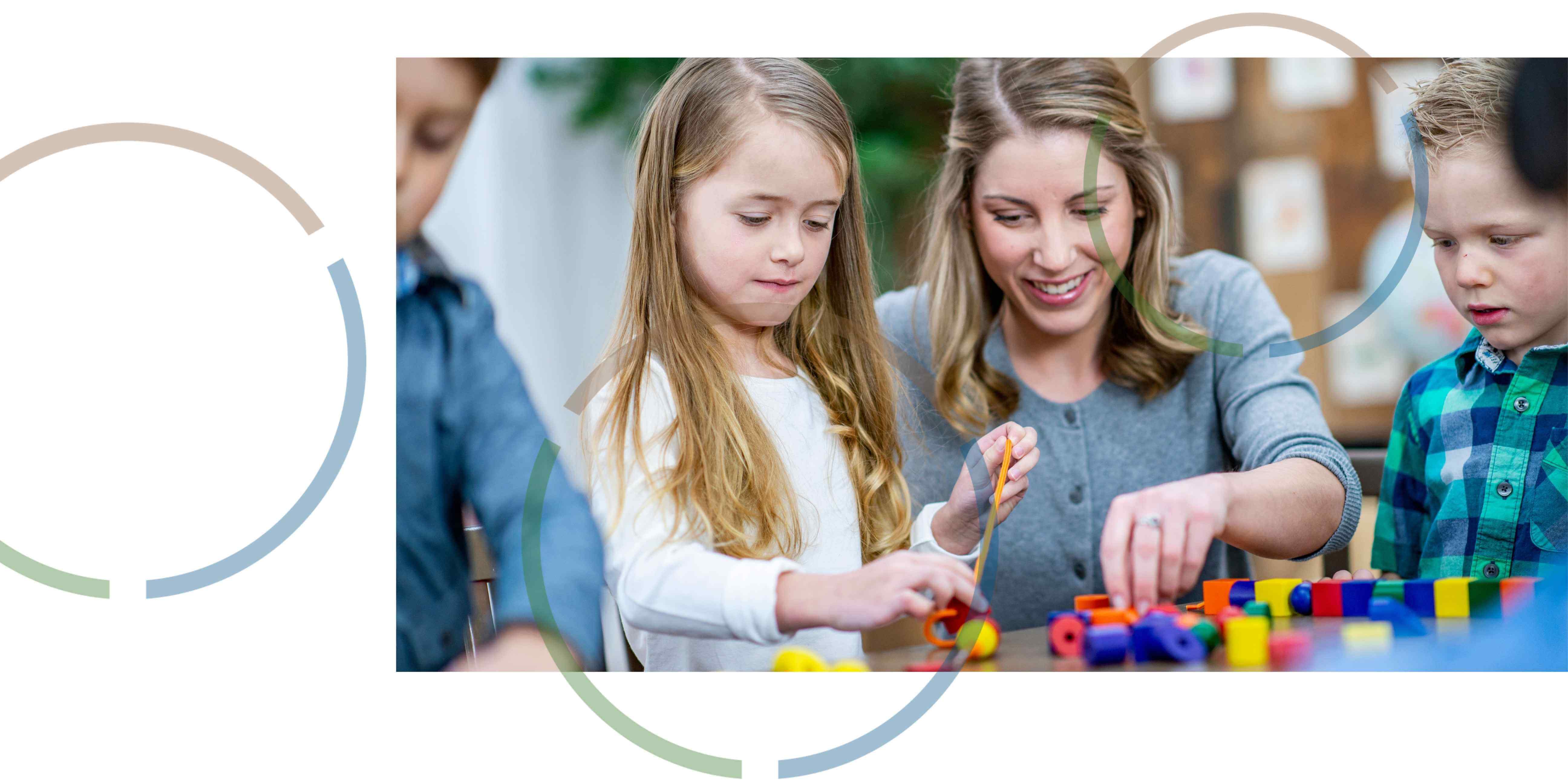 A woman and children playing with toys.