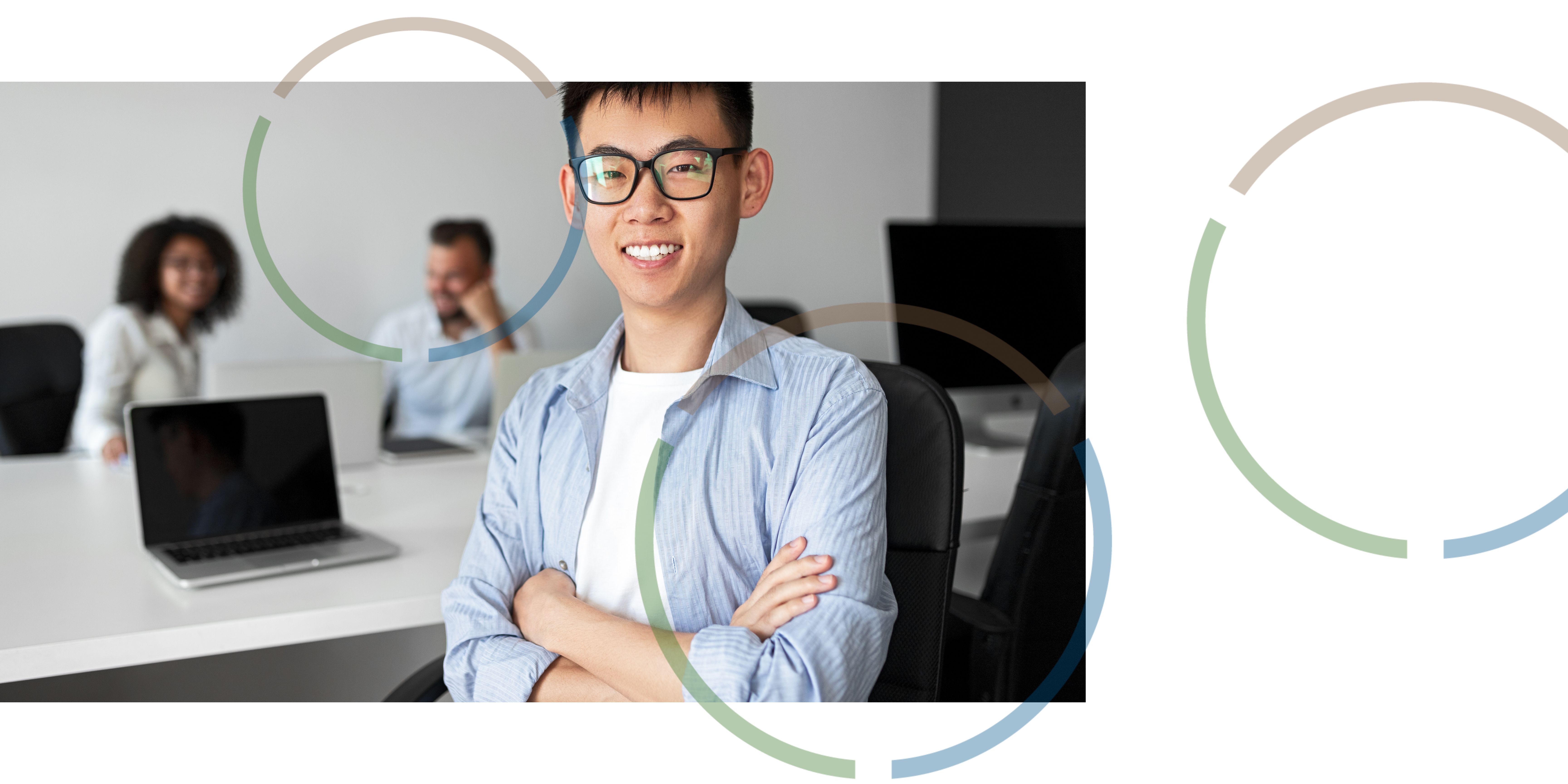 A man smiling in an office.