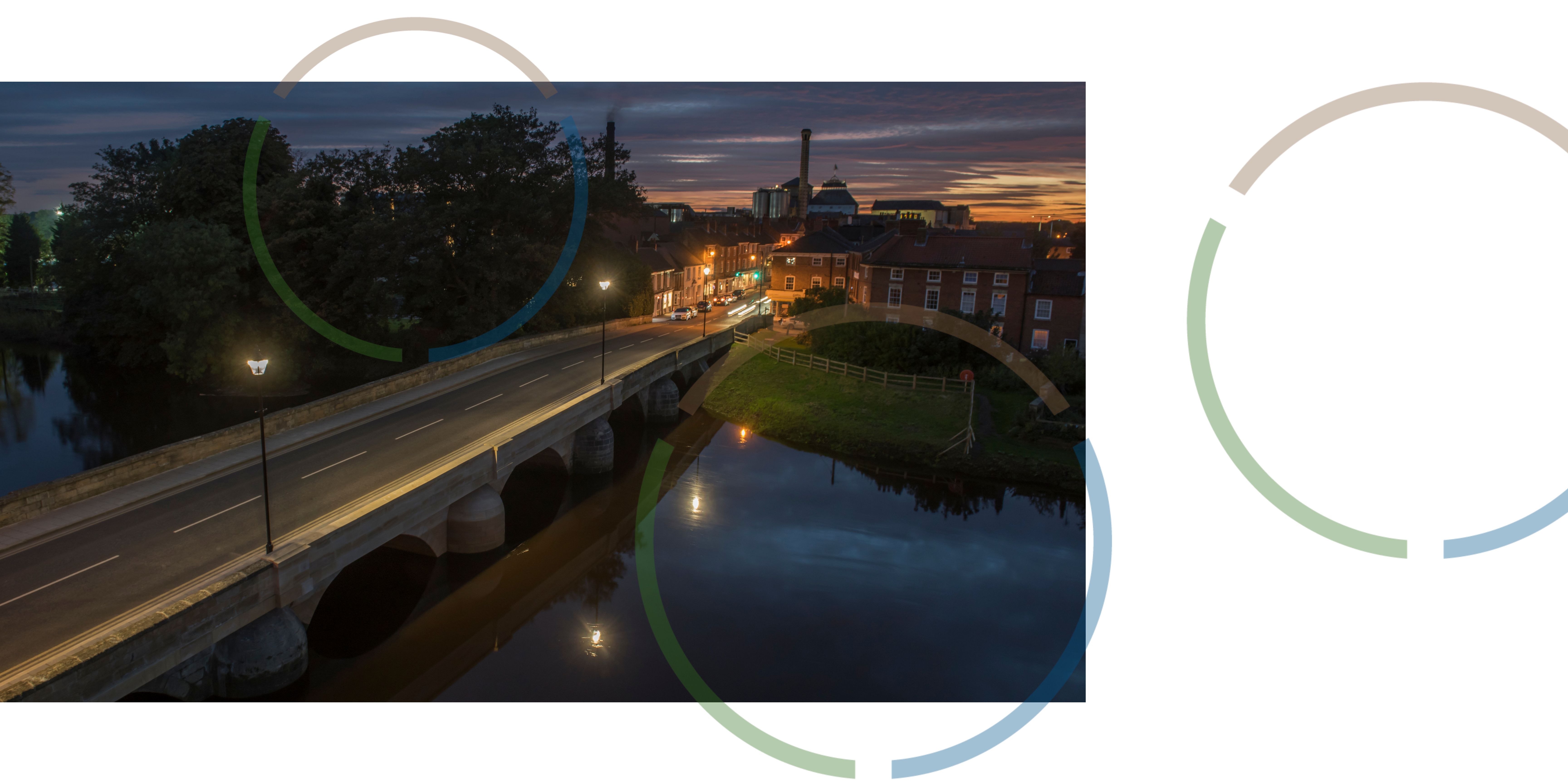 A view of a bridge at night.