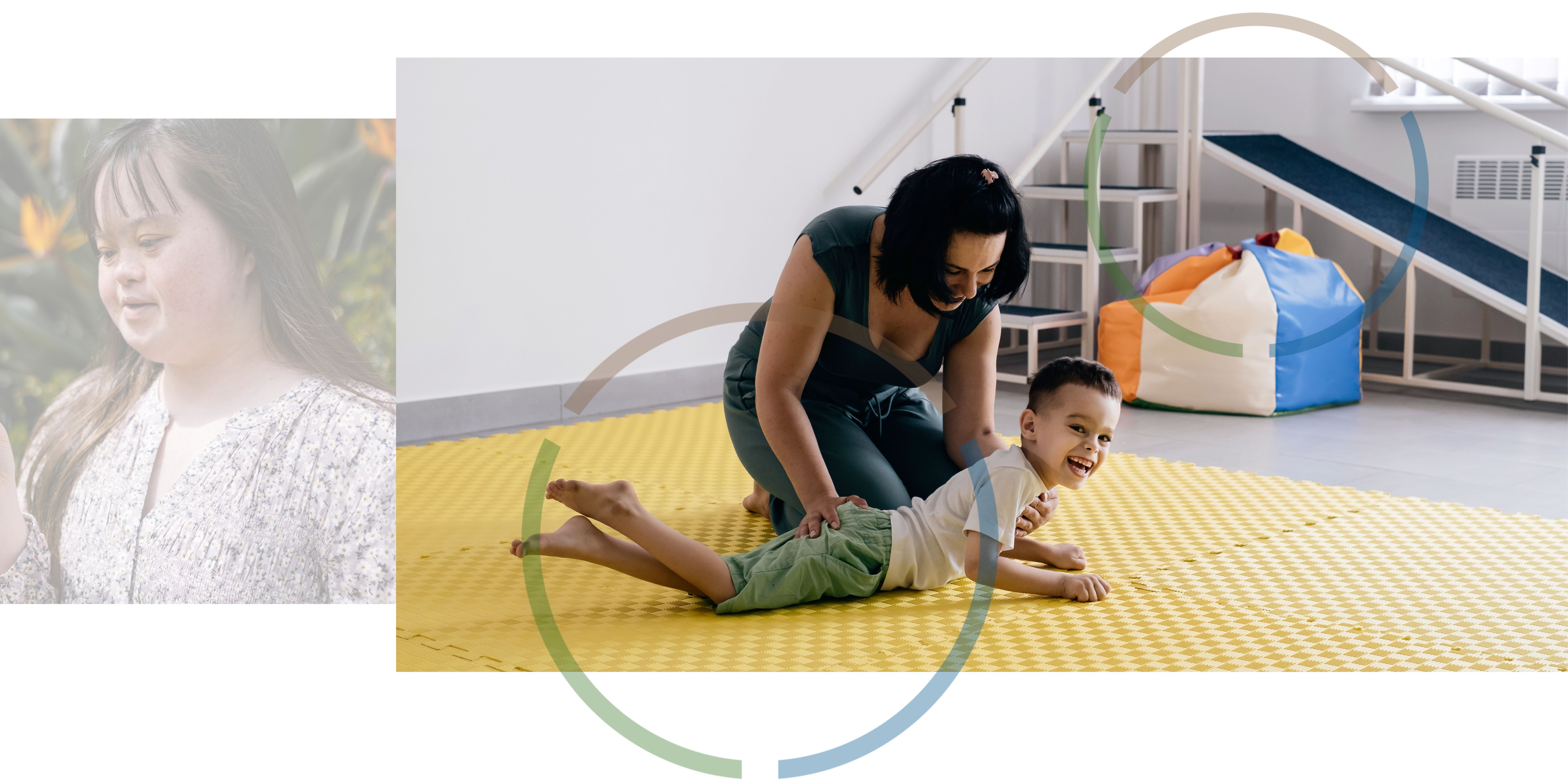 A woman and a boy playing on the floor.