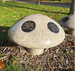 Memorial disc on granite mushroom