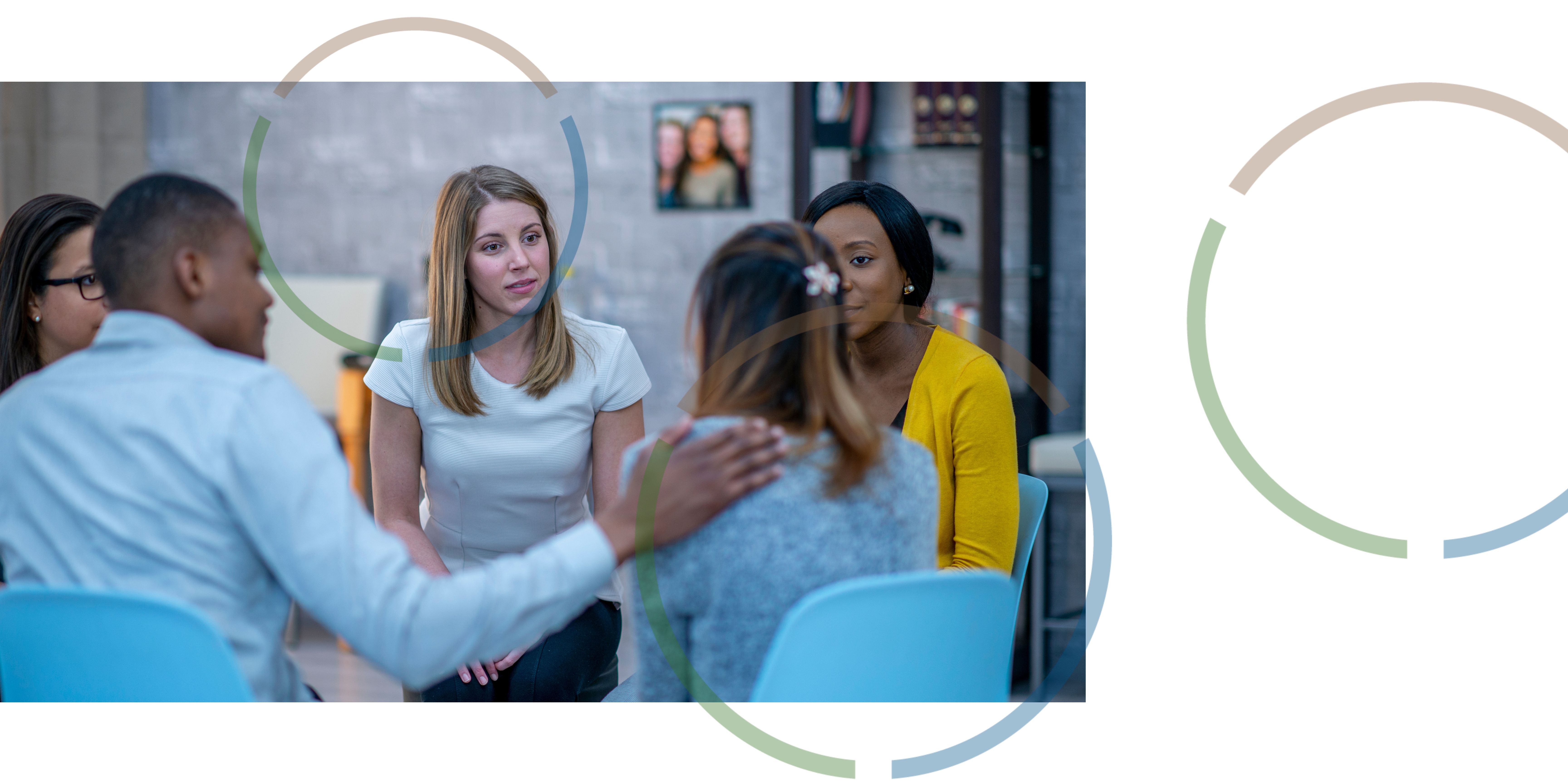 People sitting and talking in a circle.