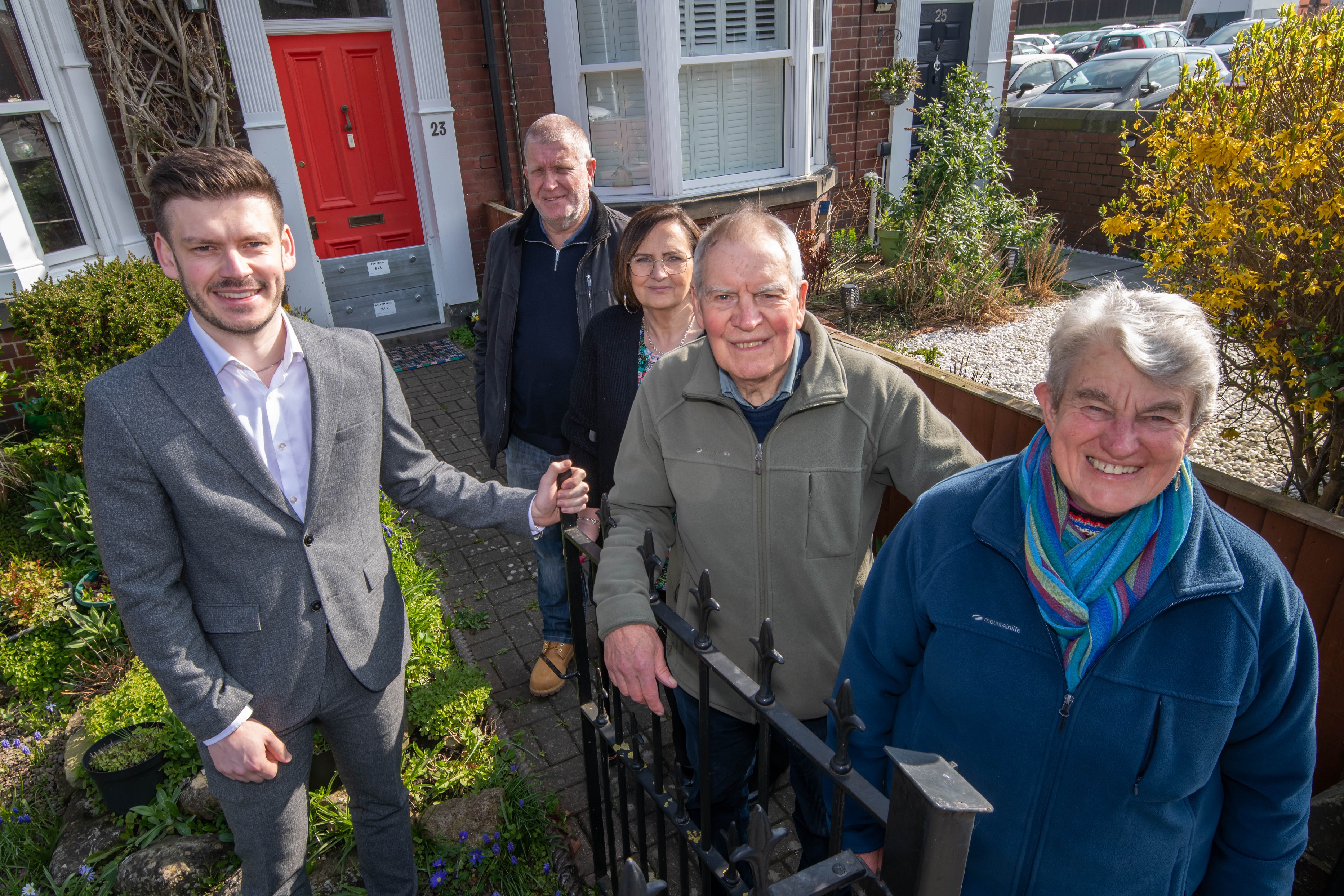 executive member for highways and transport, Cllr Keane Duncan, whose portfolio includes flood protection, with some of the householders who have benefited from improved defences at their properties. From left to right, Cllr Duncan, Terry and Clare Harding, and Peter and Janice Clark
