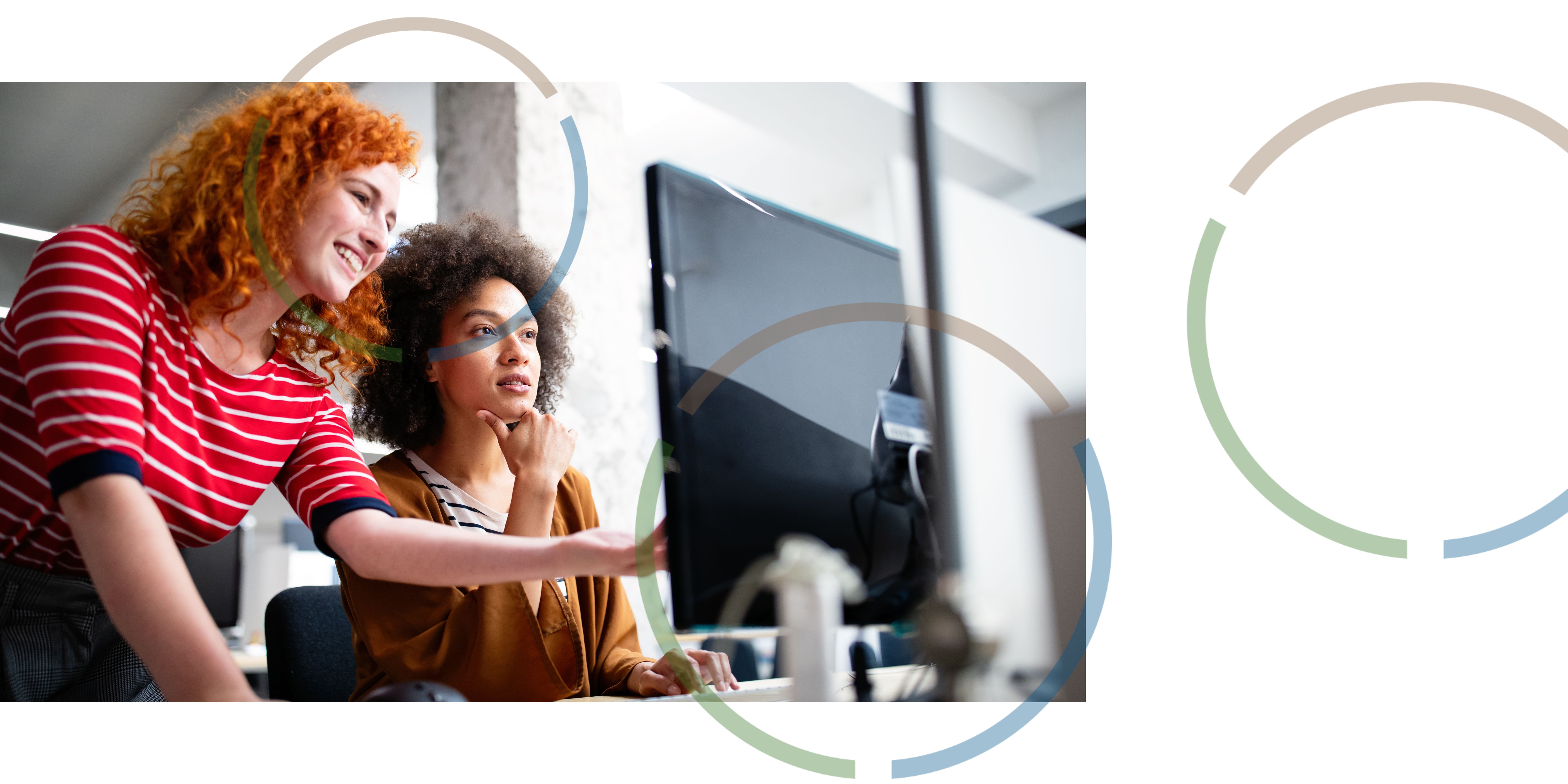 Women looking at information on a computer.