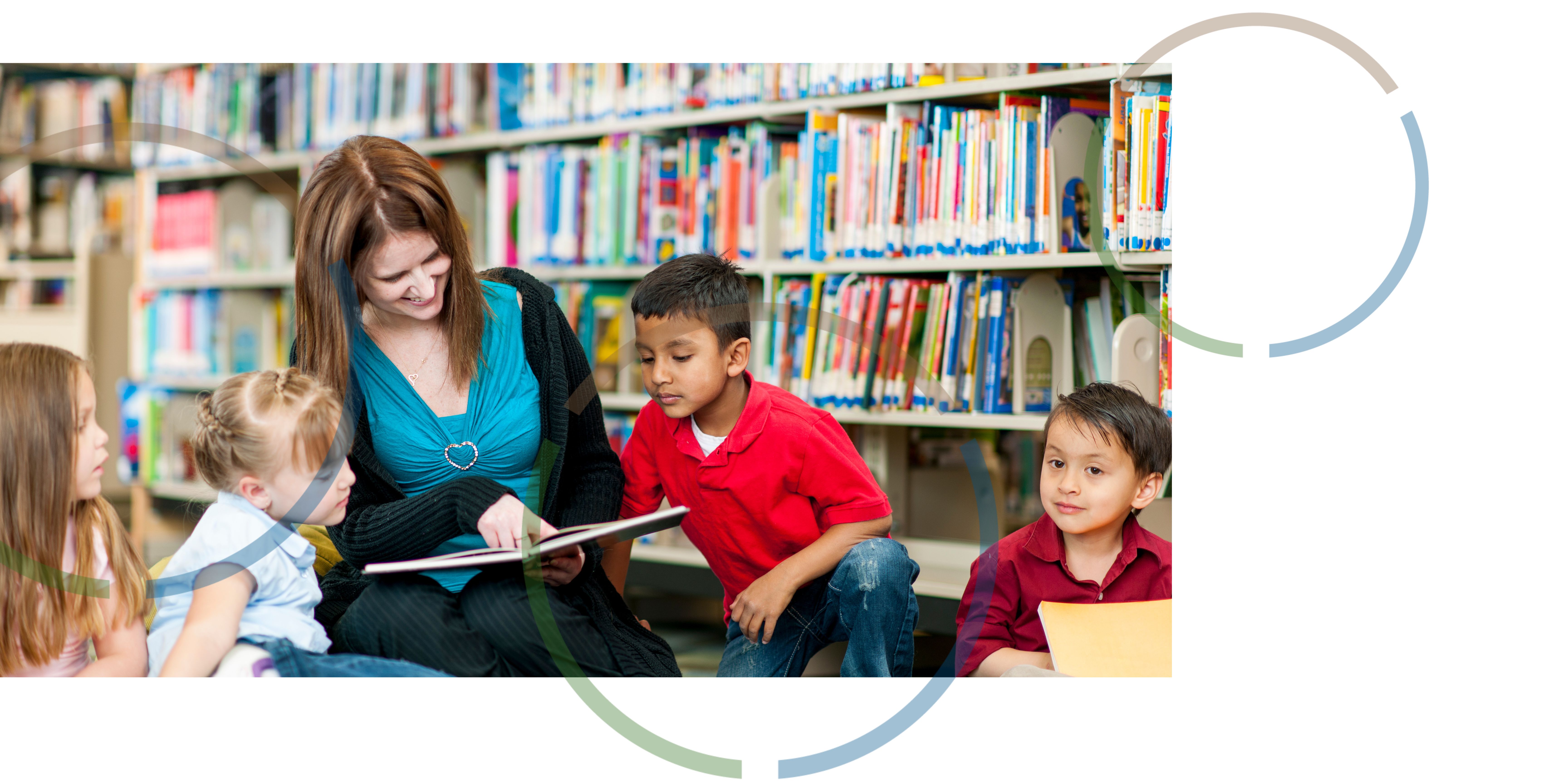 A woman reading a book to children.