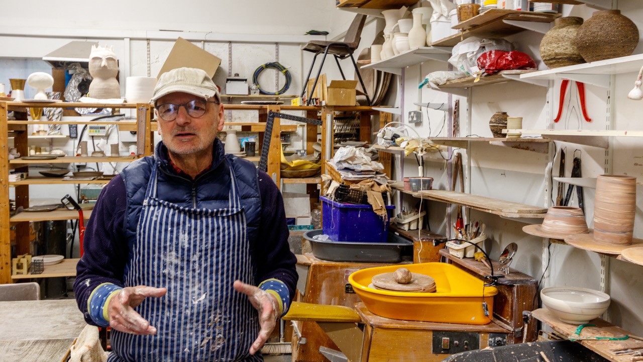 A pottery artist in their studio