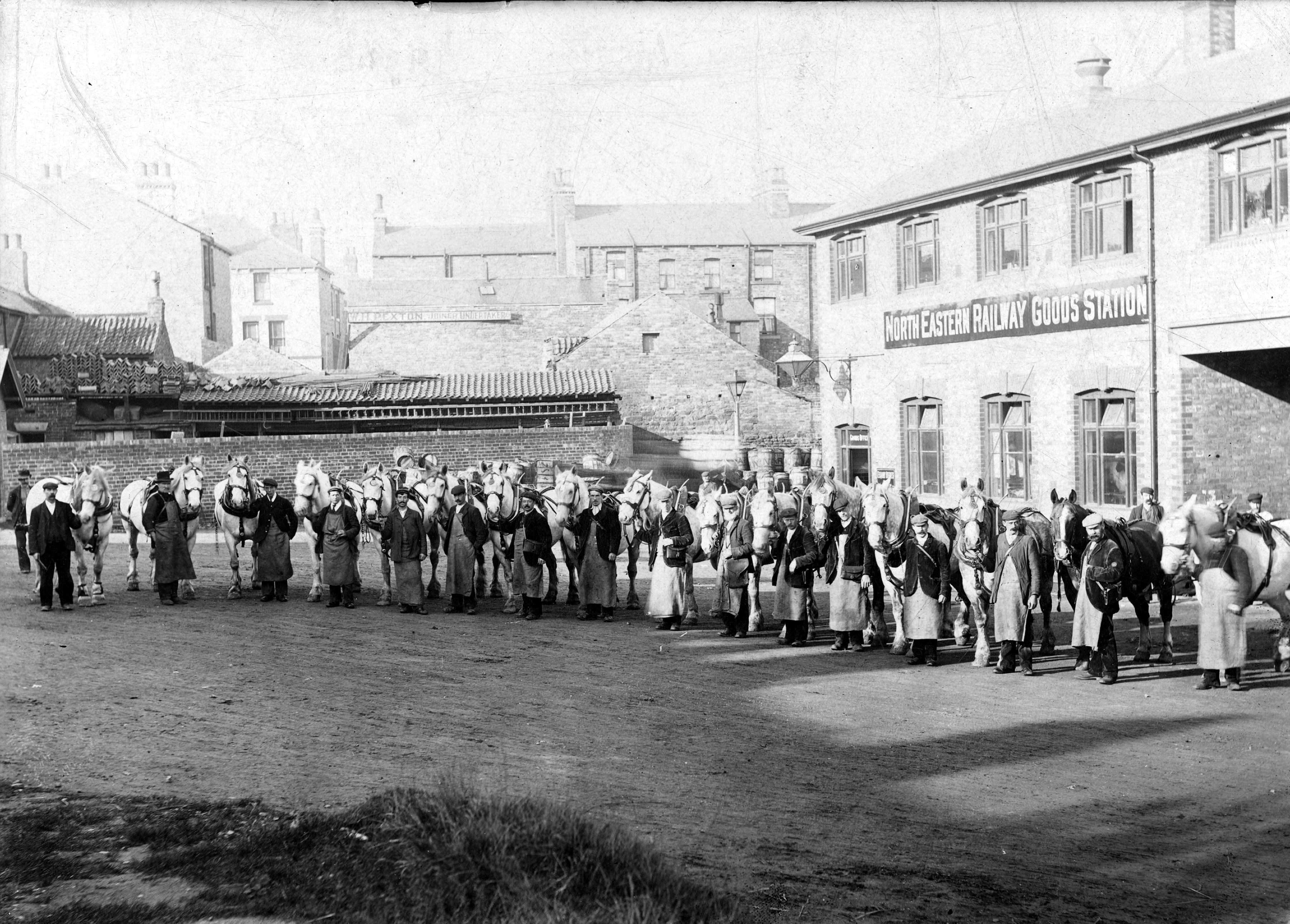 Railway goods yard and horses