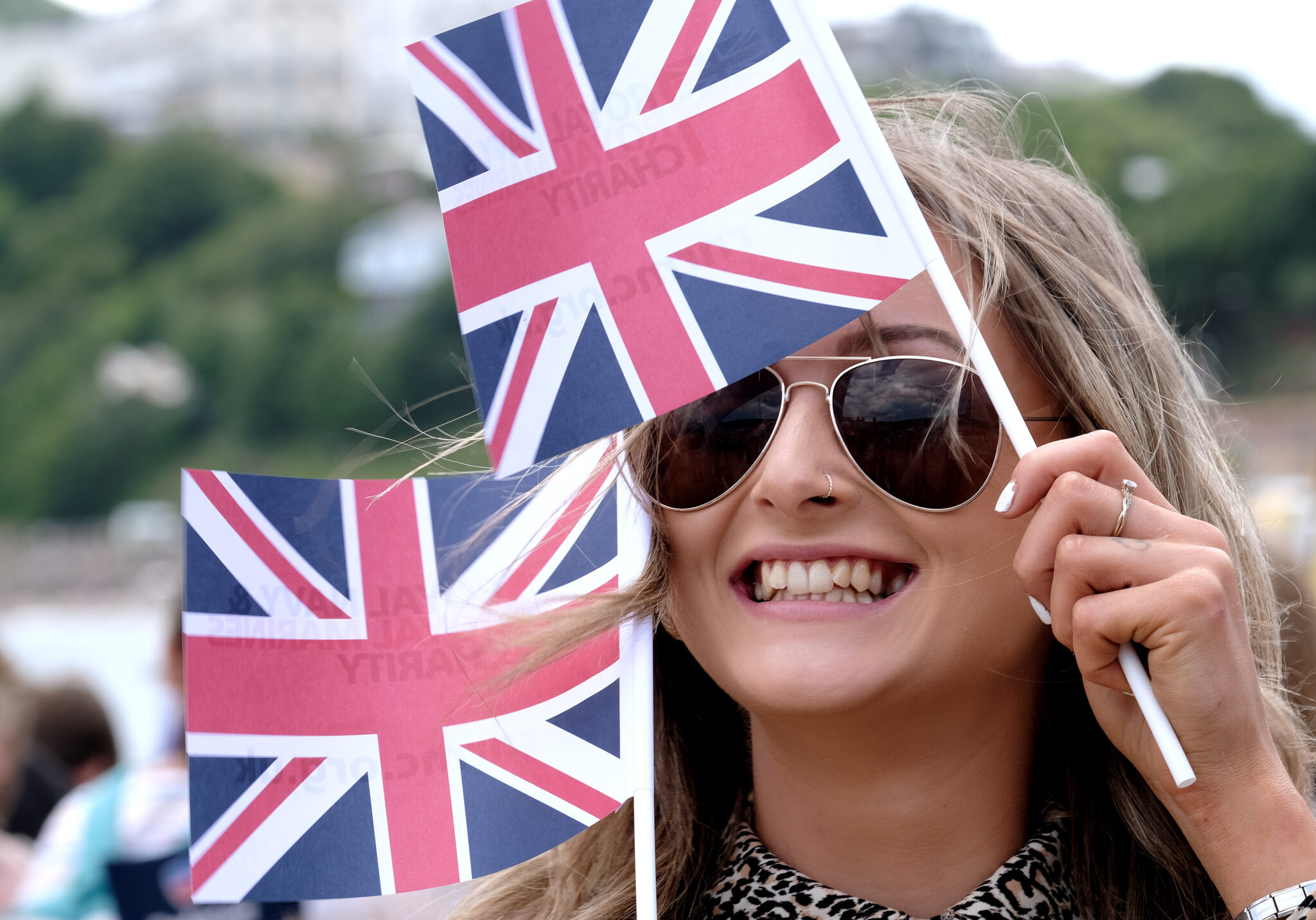 A lady with two union flags