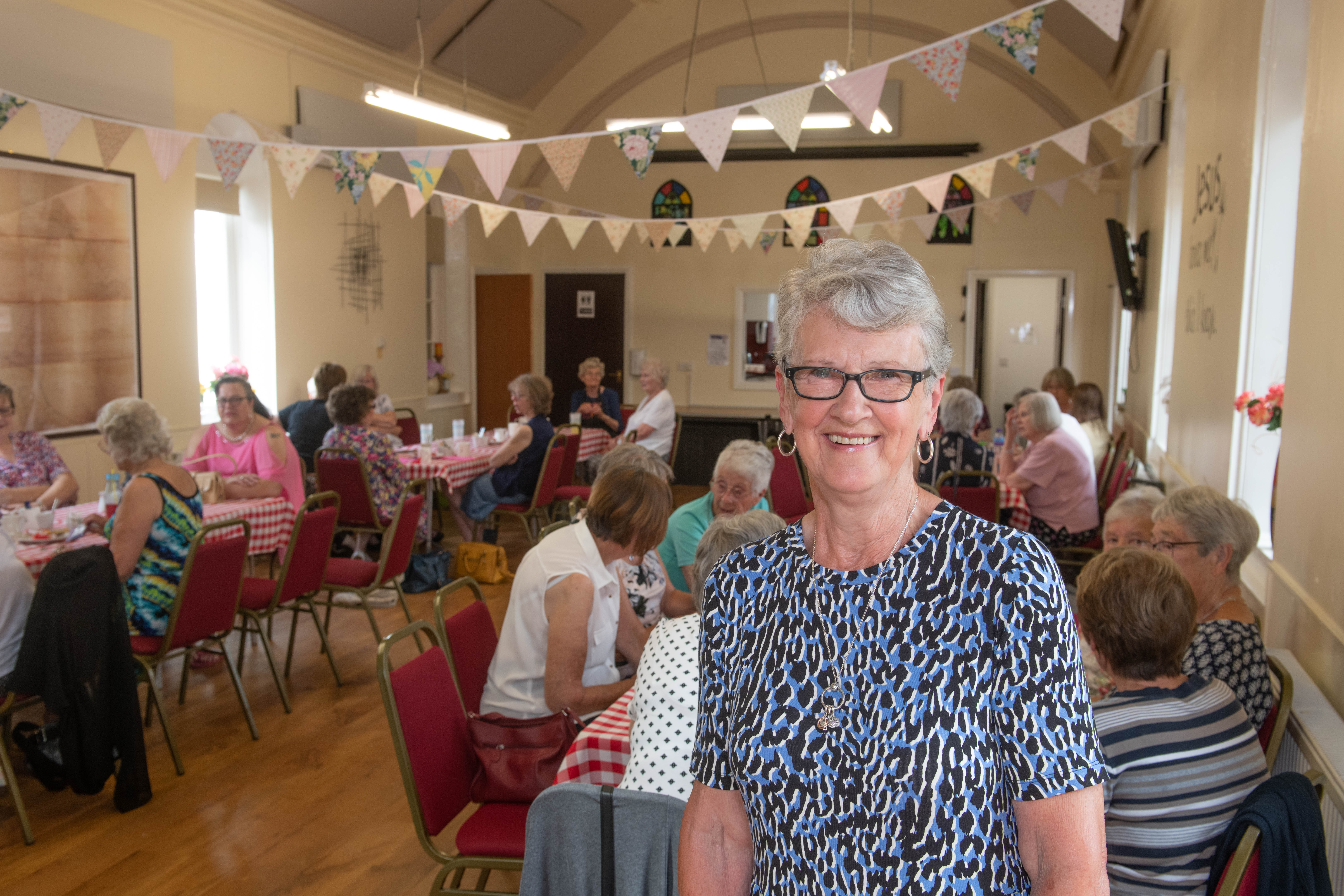 A lady inside a community hall