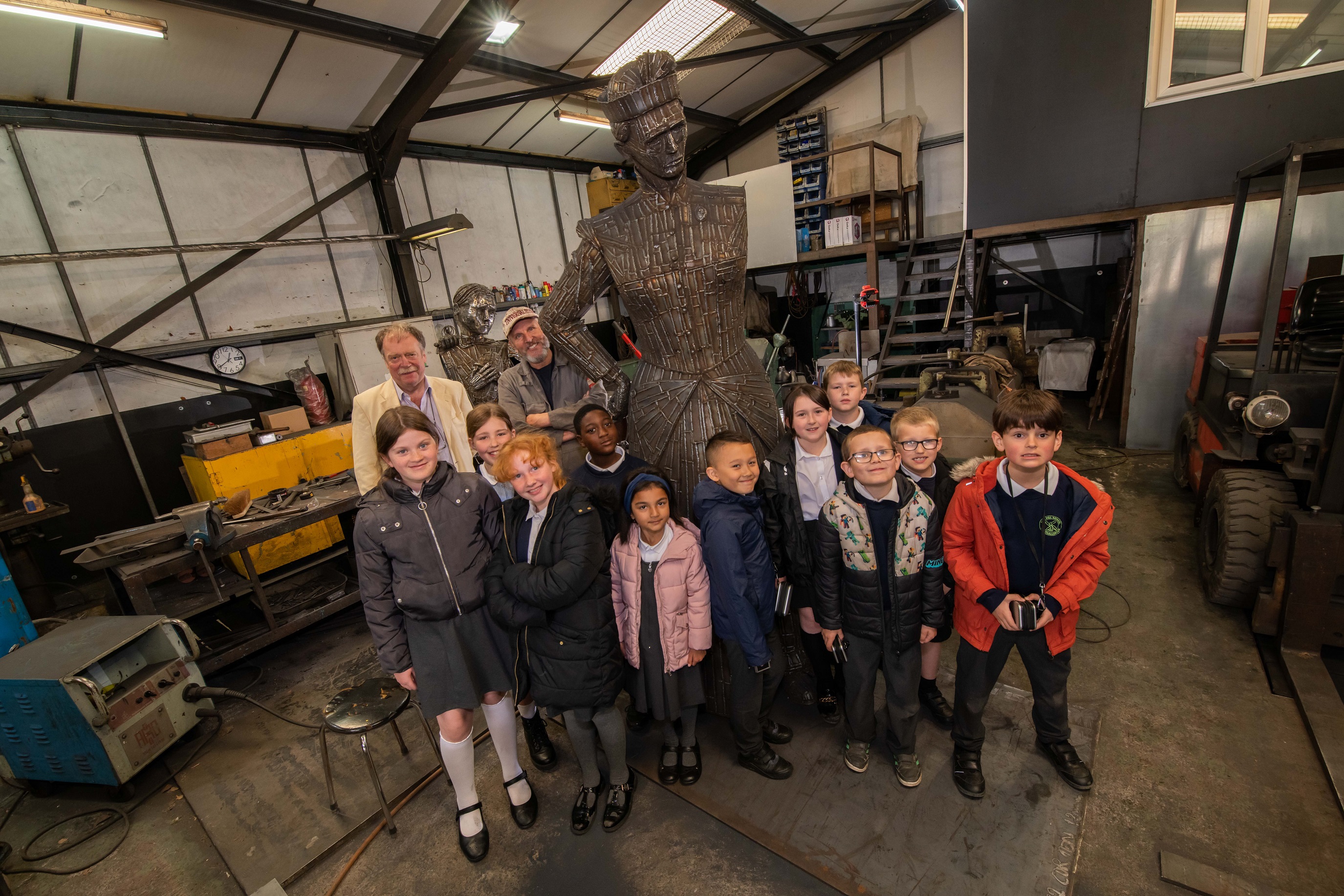 Children looking at the Sophia sculpture