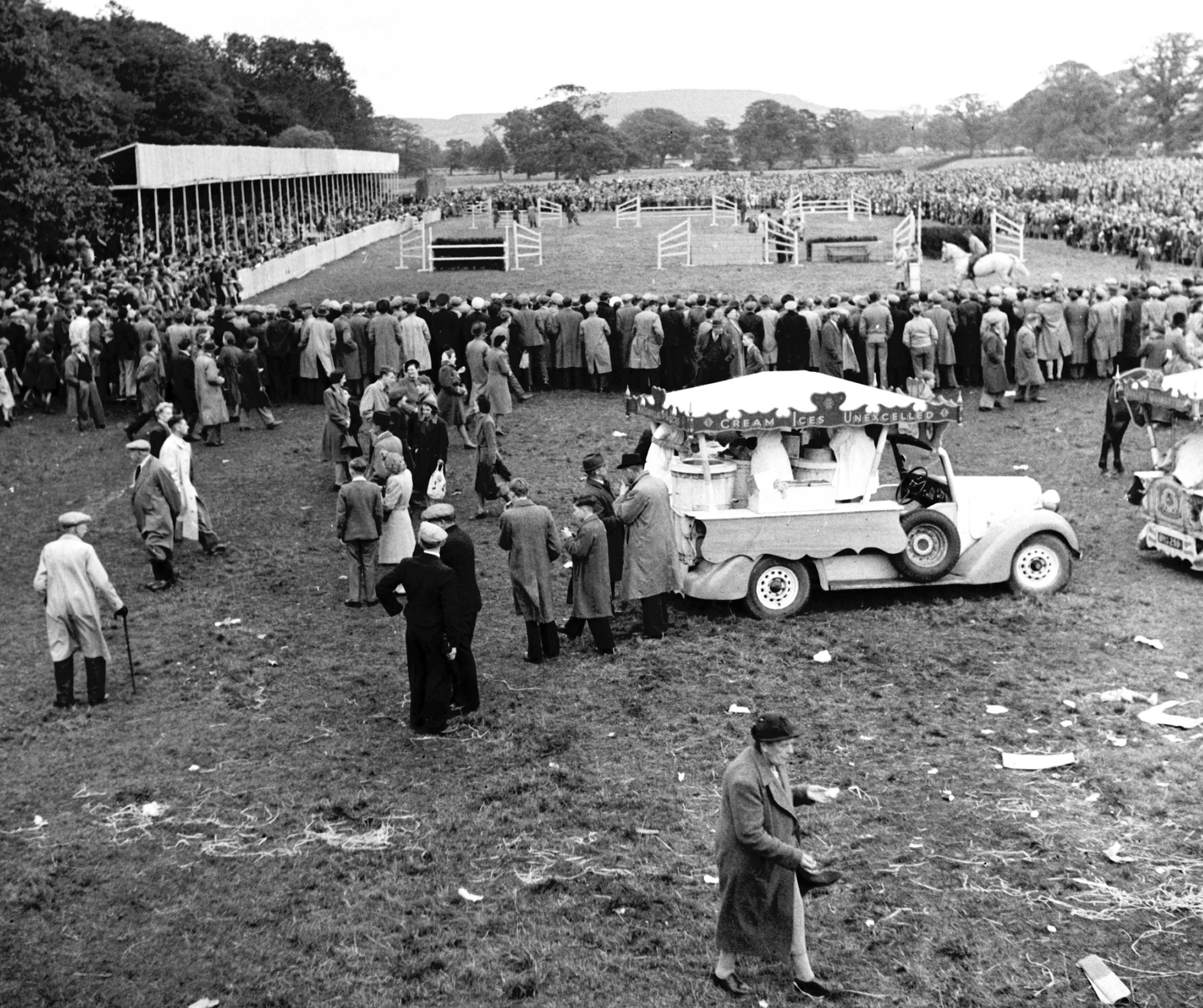 A crowd watches the show jumping event at the 1946 Stokesley Show.