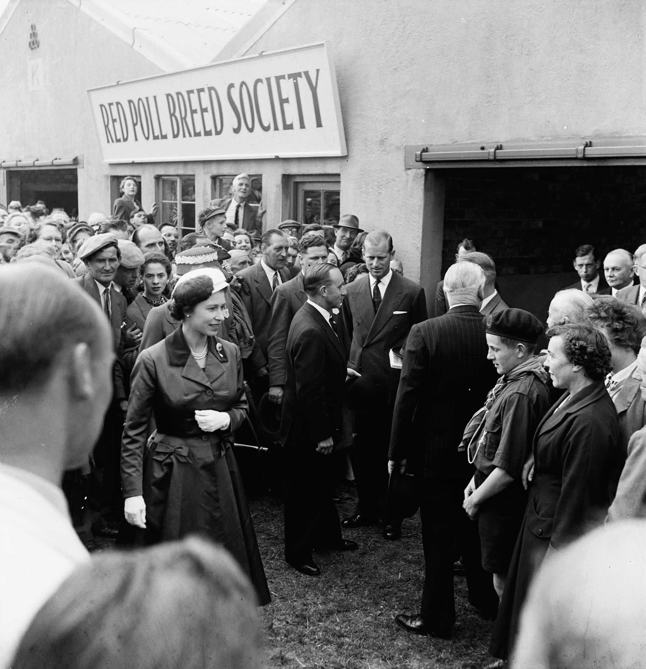 The Queen and Prince Philip at the Red Poll Breed Society tent at the show, also in 1957.