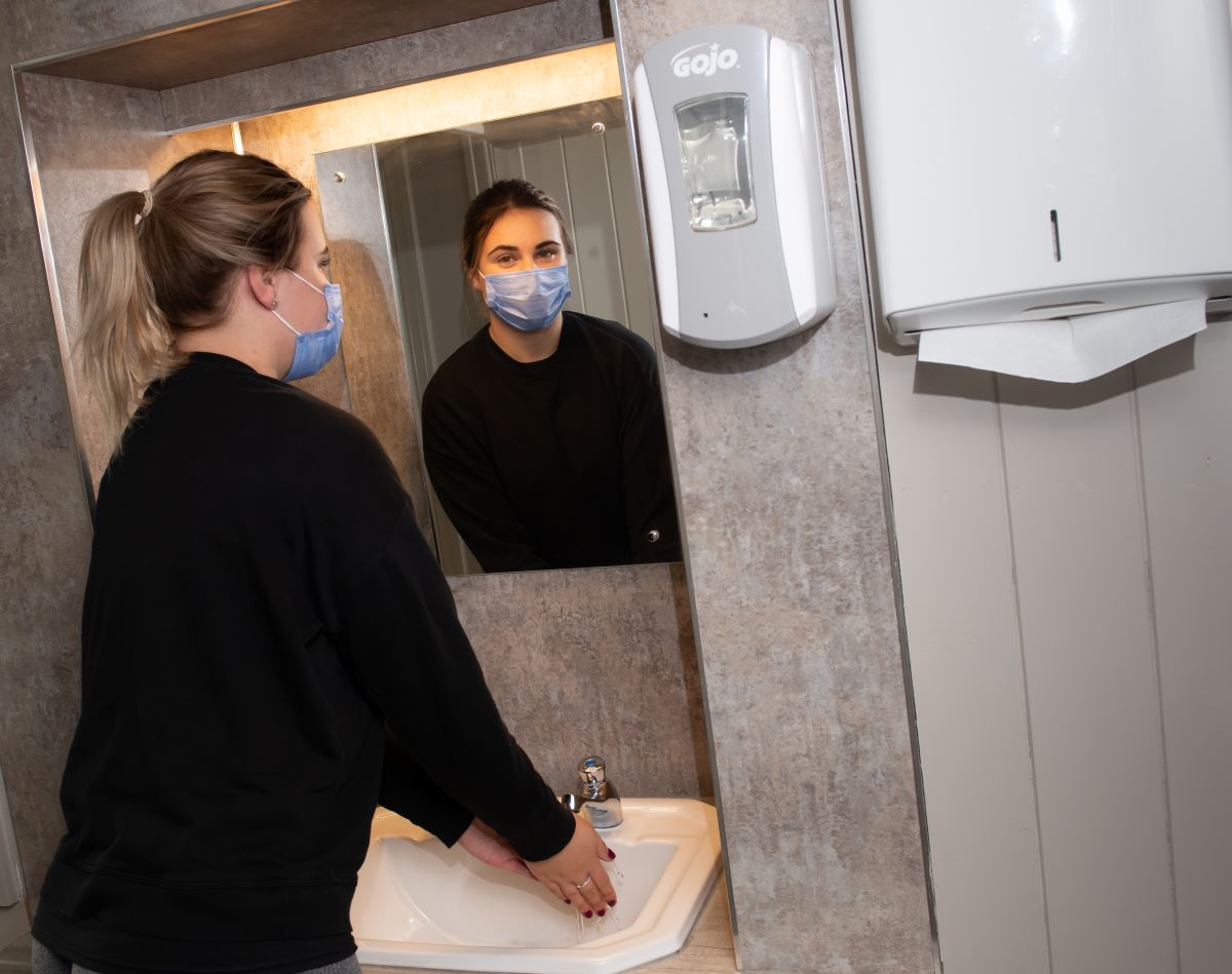 A woman washing her hands during the covid pandemic