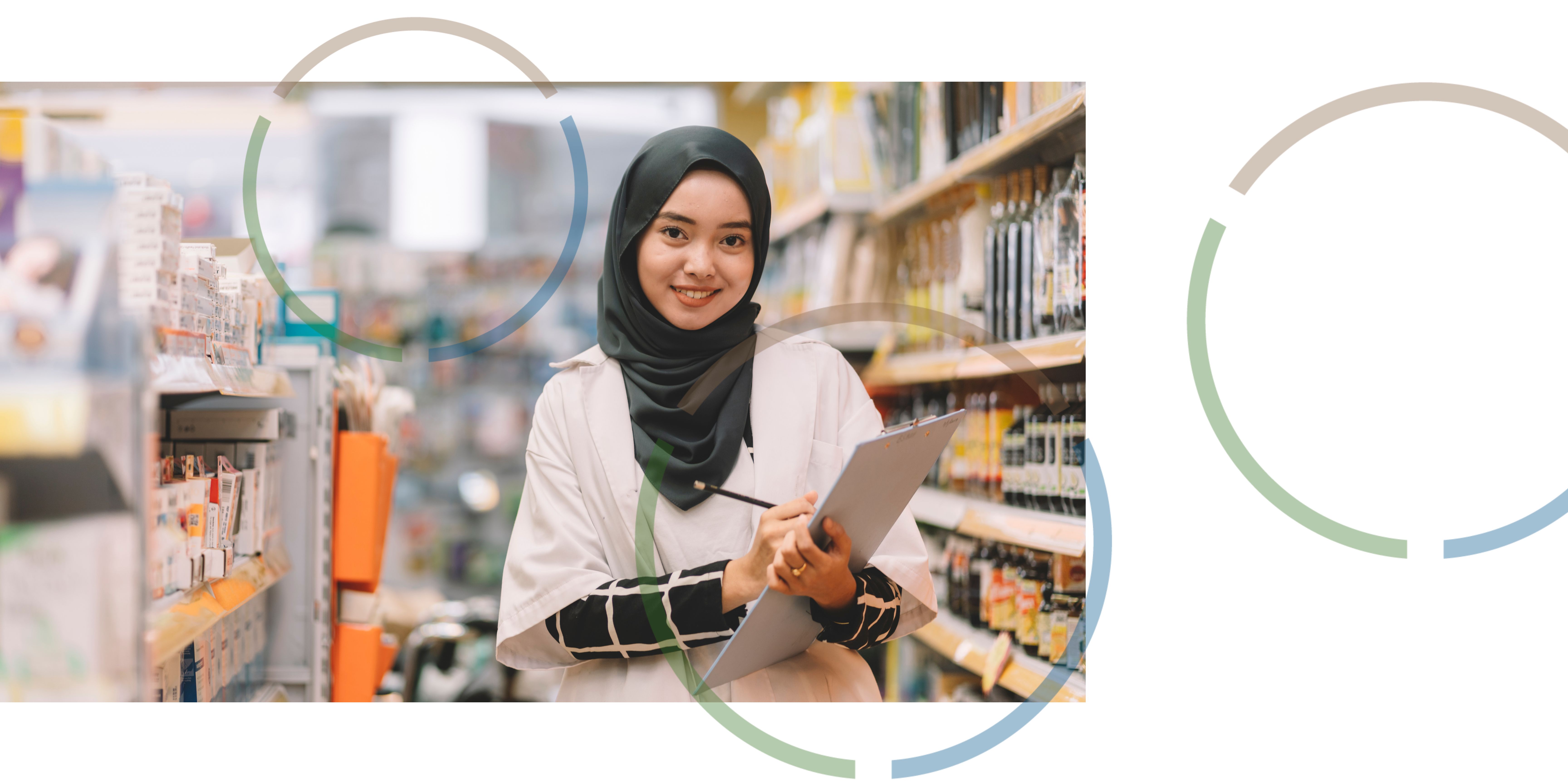 A smiling woman making notes on a clipboard.