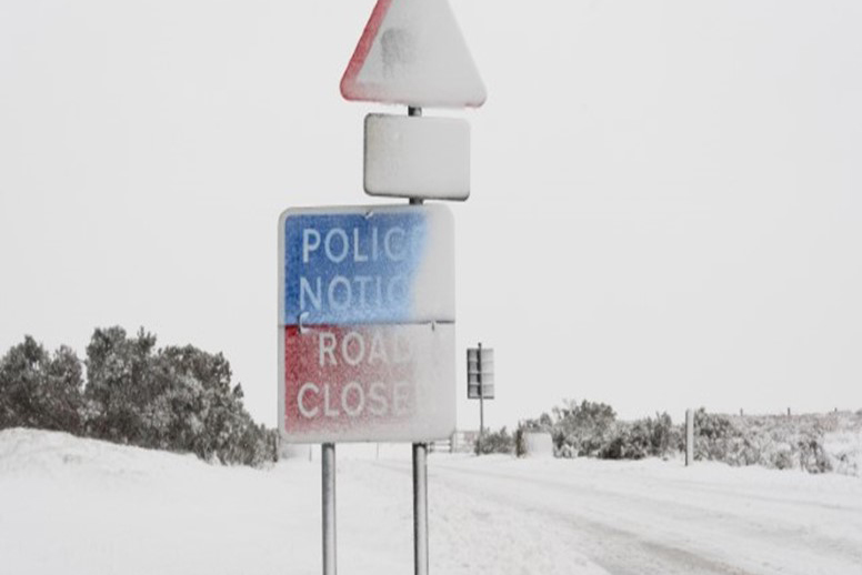 A snow covered road sign in North Yorkshire