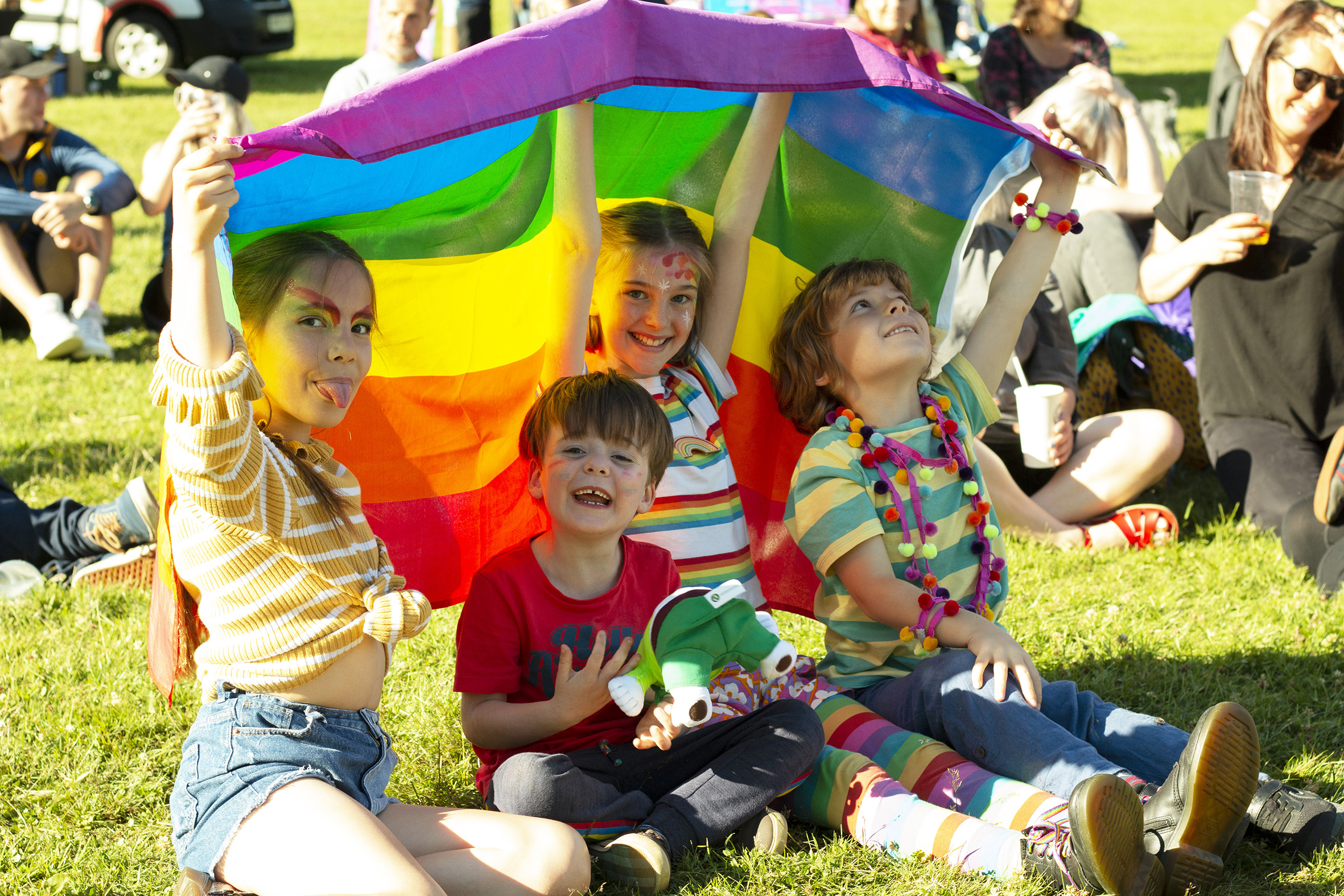 A family with a pride flag