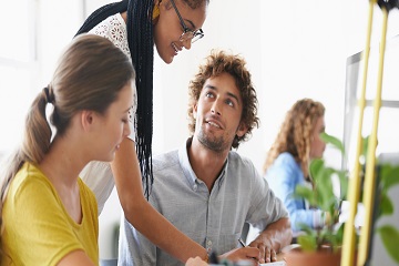 Young people working together in a bright office.