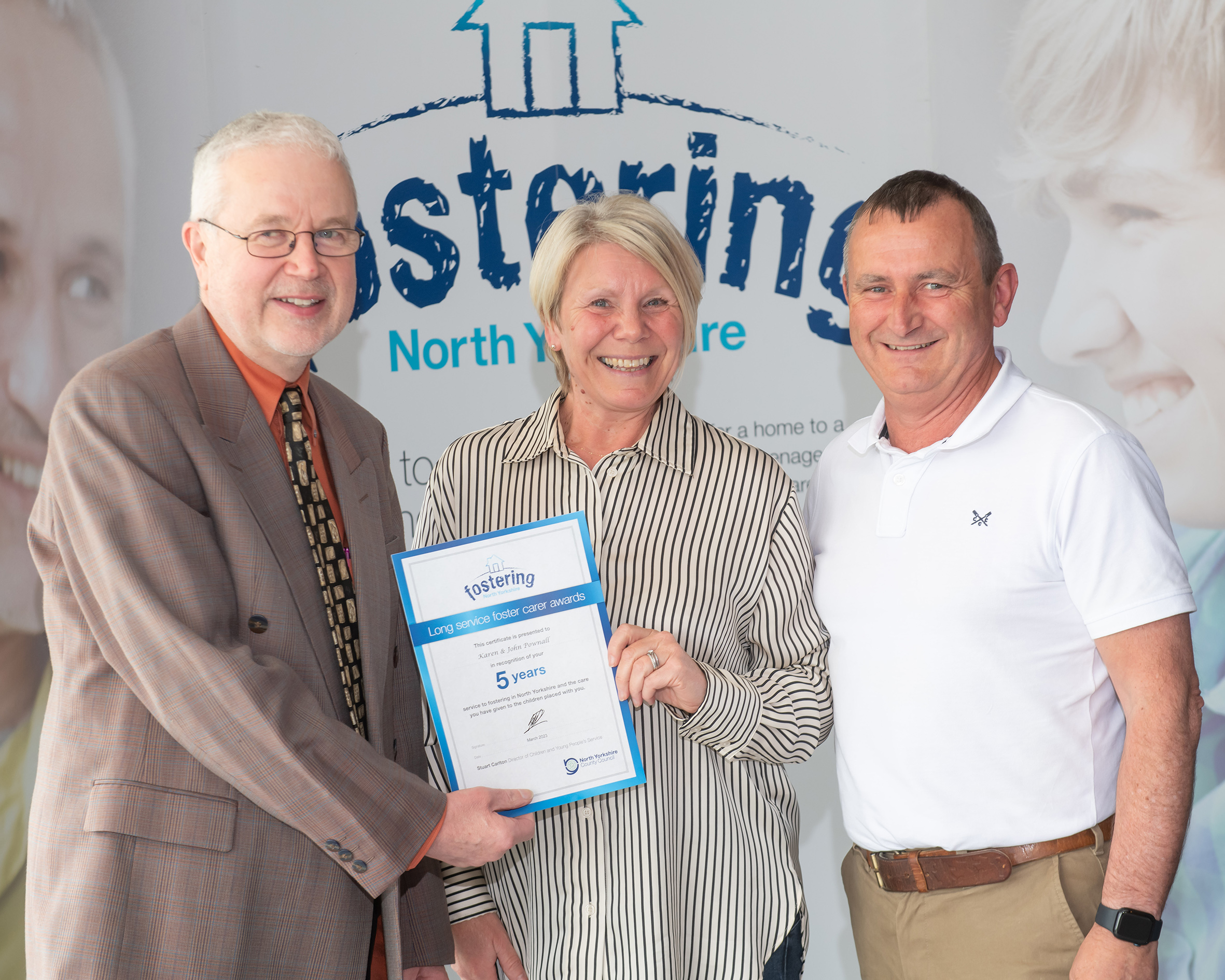 Foster carers John and Karen Pownall with North Yorkshire Council’s placement and fostering manager, Alan Tucker, at an annual conference earlier this year after being recognised for the rewarding work they do.