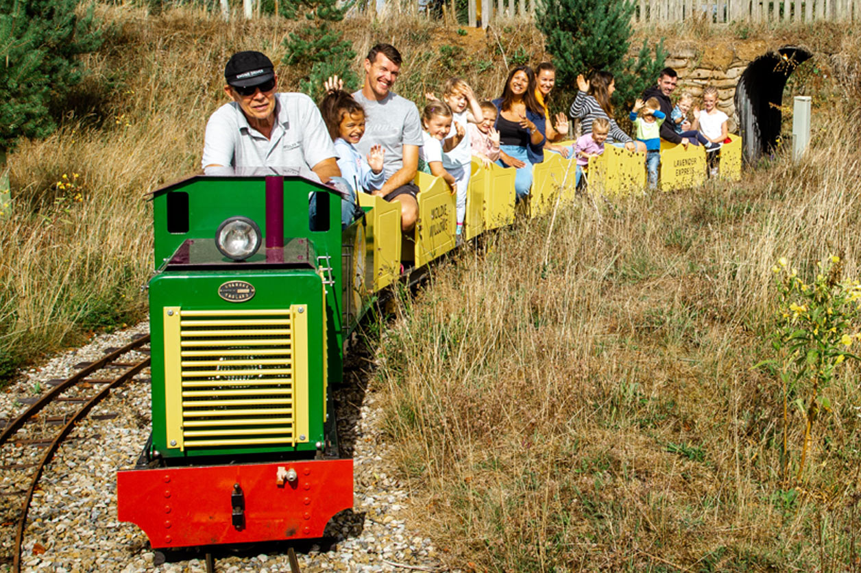 People on a mini train