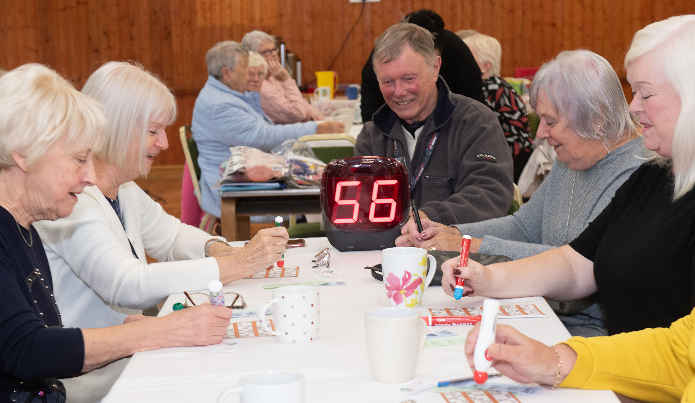 Cllr Mike Jordan calls the numbers for eager bingo players at Drax Wednesday Club using the new machine.