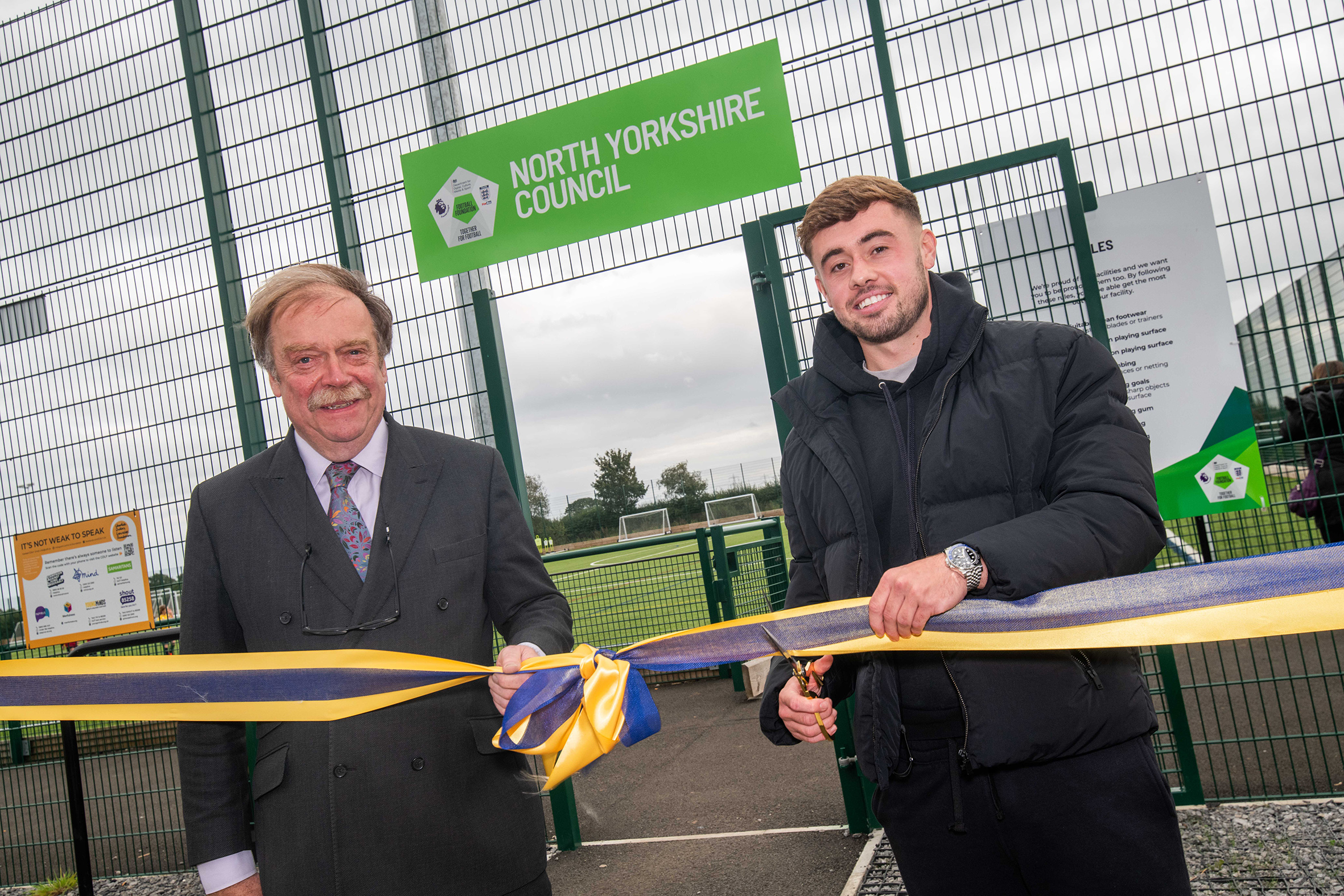 Carlisle United Midfielder Alfie McCalmont cutting the ribbon at the official opening of a new 3G pitch and pavilion at the Sowerby Sports Village. 