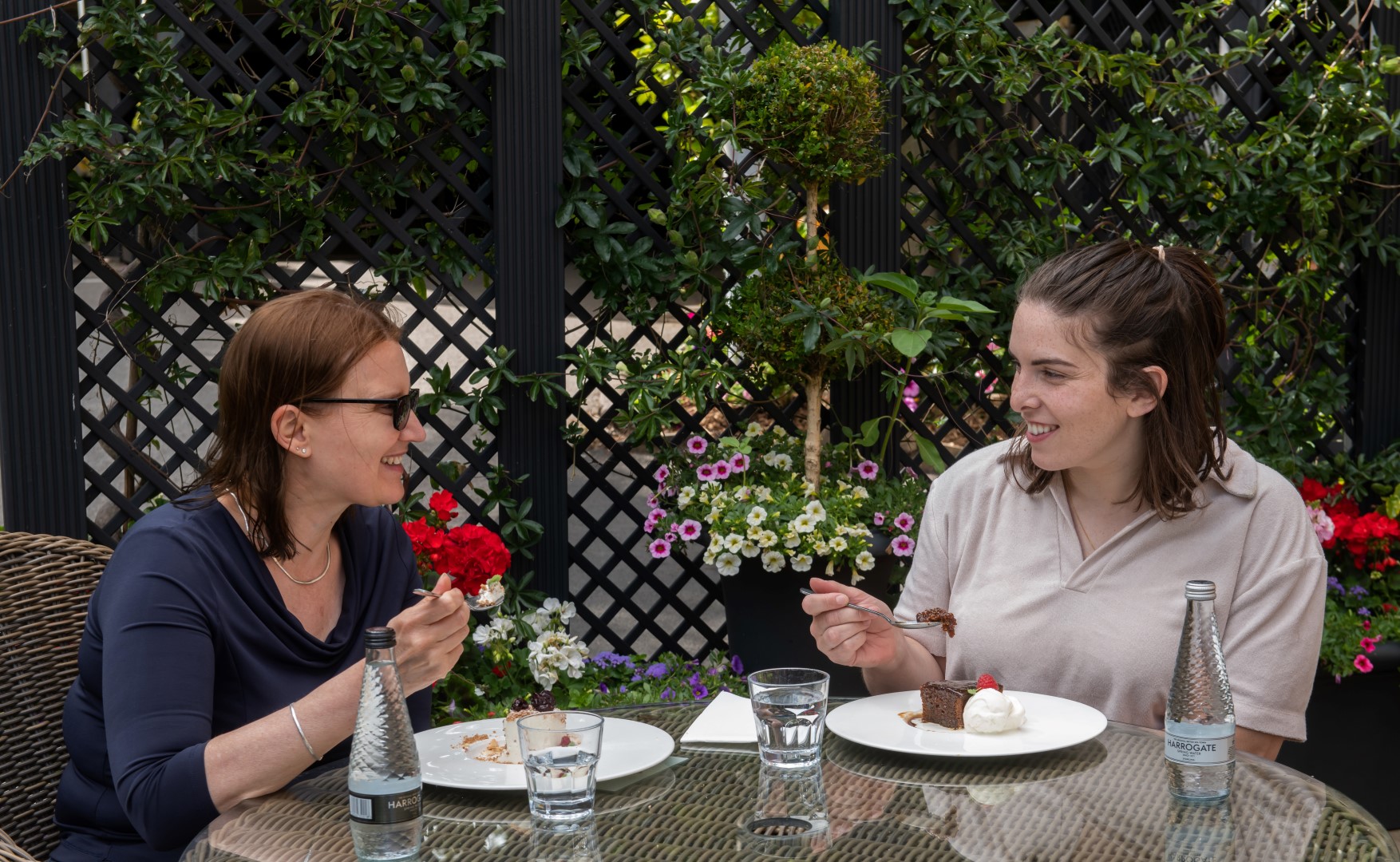 Two friends at a table eating