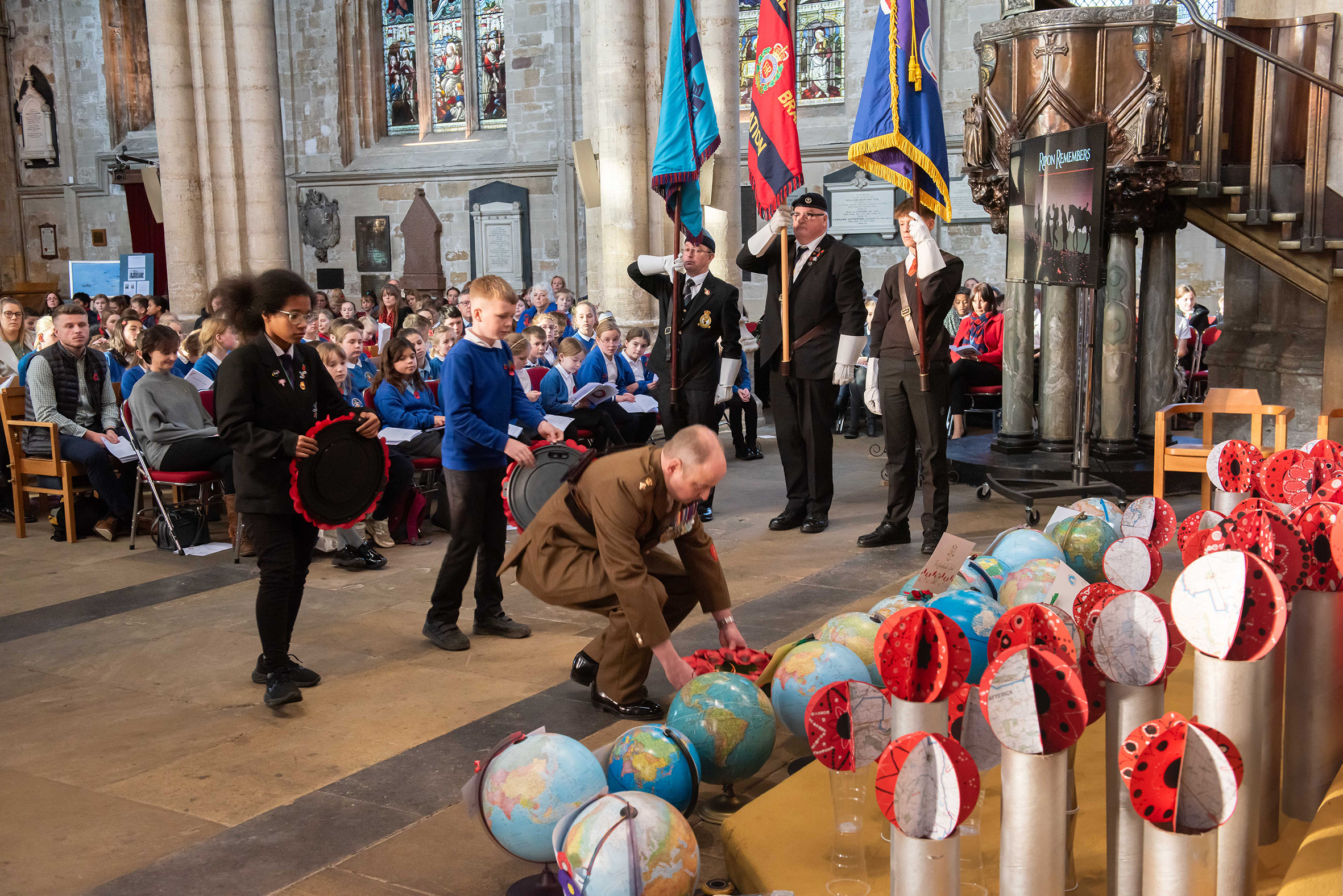 2.	Children from Wavell and Risedale schools lay wreaths with Catterick Garrison’s Commander, Lt Col Charlie Anderson,
