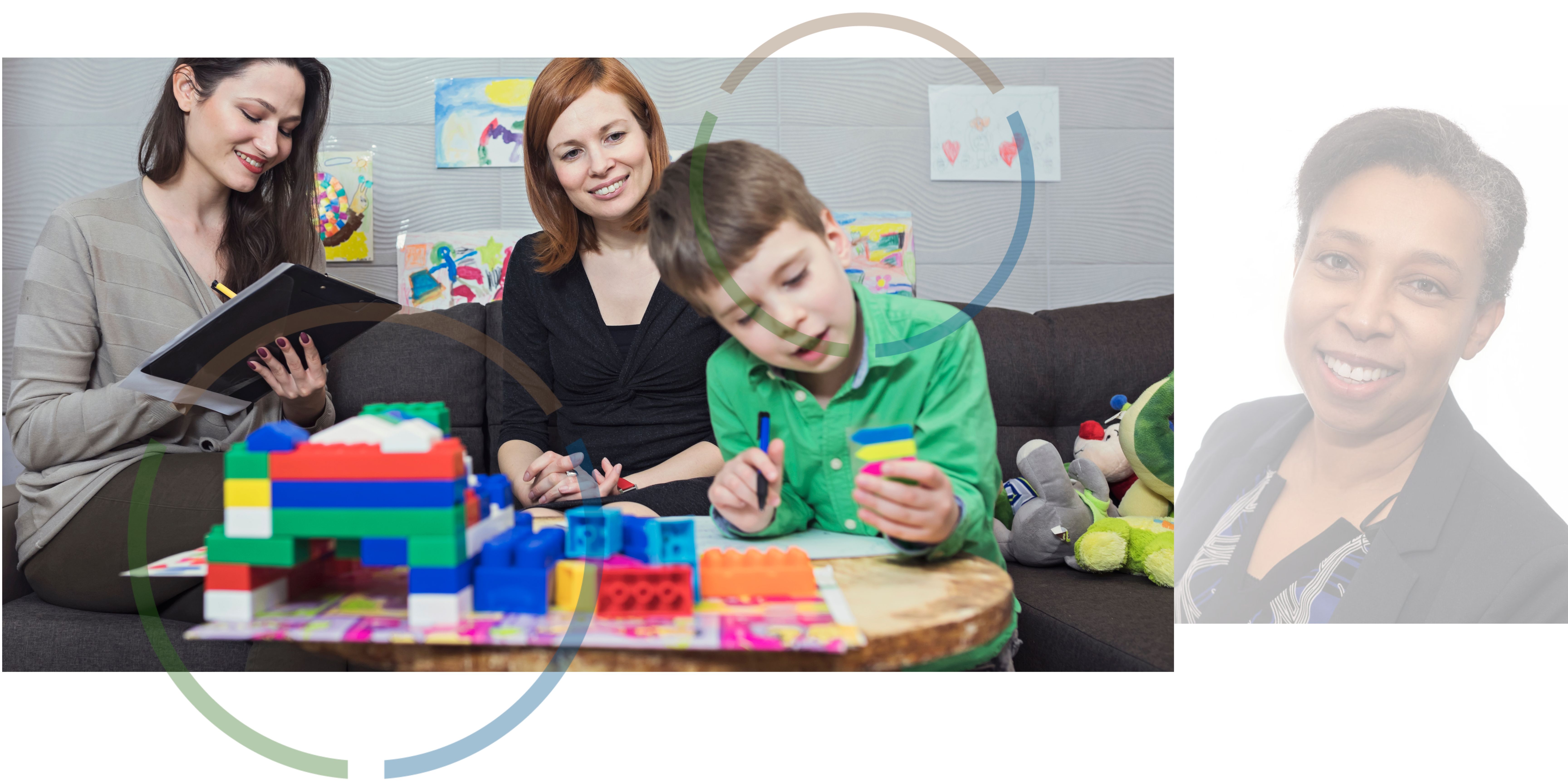 Women making notes while a boy plays with toys. 