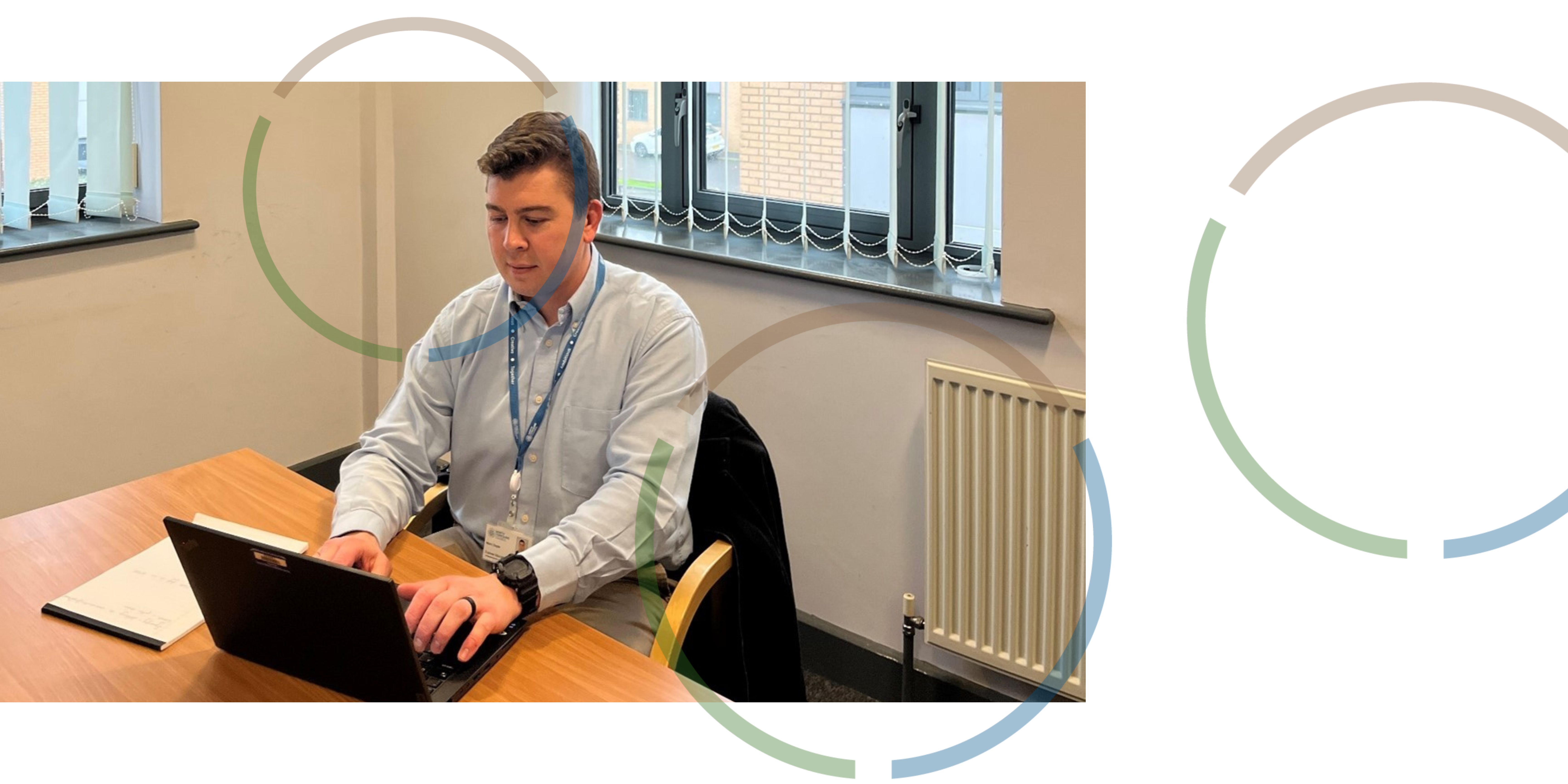 A member of the educational psychology team working on a laptop.