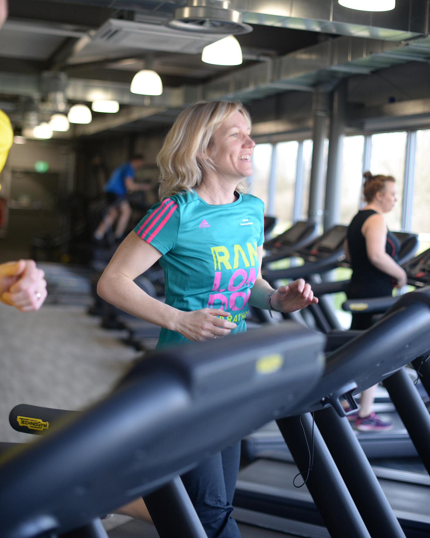 A lady running on a treadmill