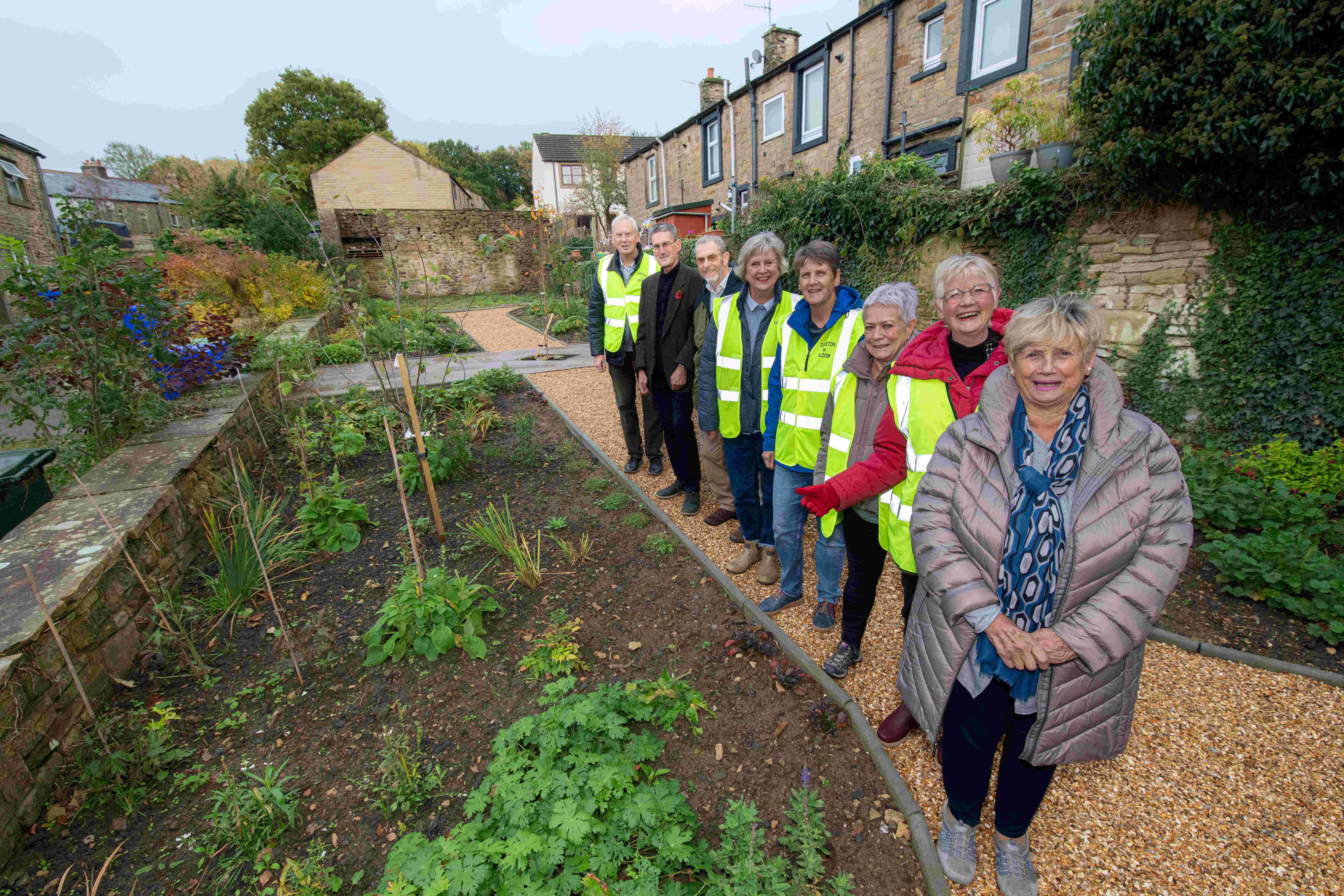Member for the Skipton West and West Craven division, Cllr Andy Solloway, joins representatives from Carleton in Bloom in the community garden which is making a real difference to the local area. (From left to right) John Waterhouse, Cllr Solloway, Chris Judge, Sue Brown, Corinne Ludford, Fiona Steel, Carol Stocks and Vicki Woodhead.