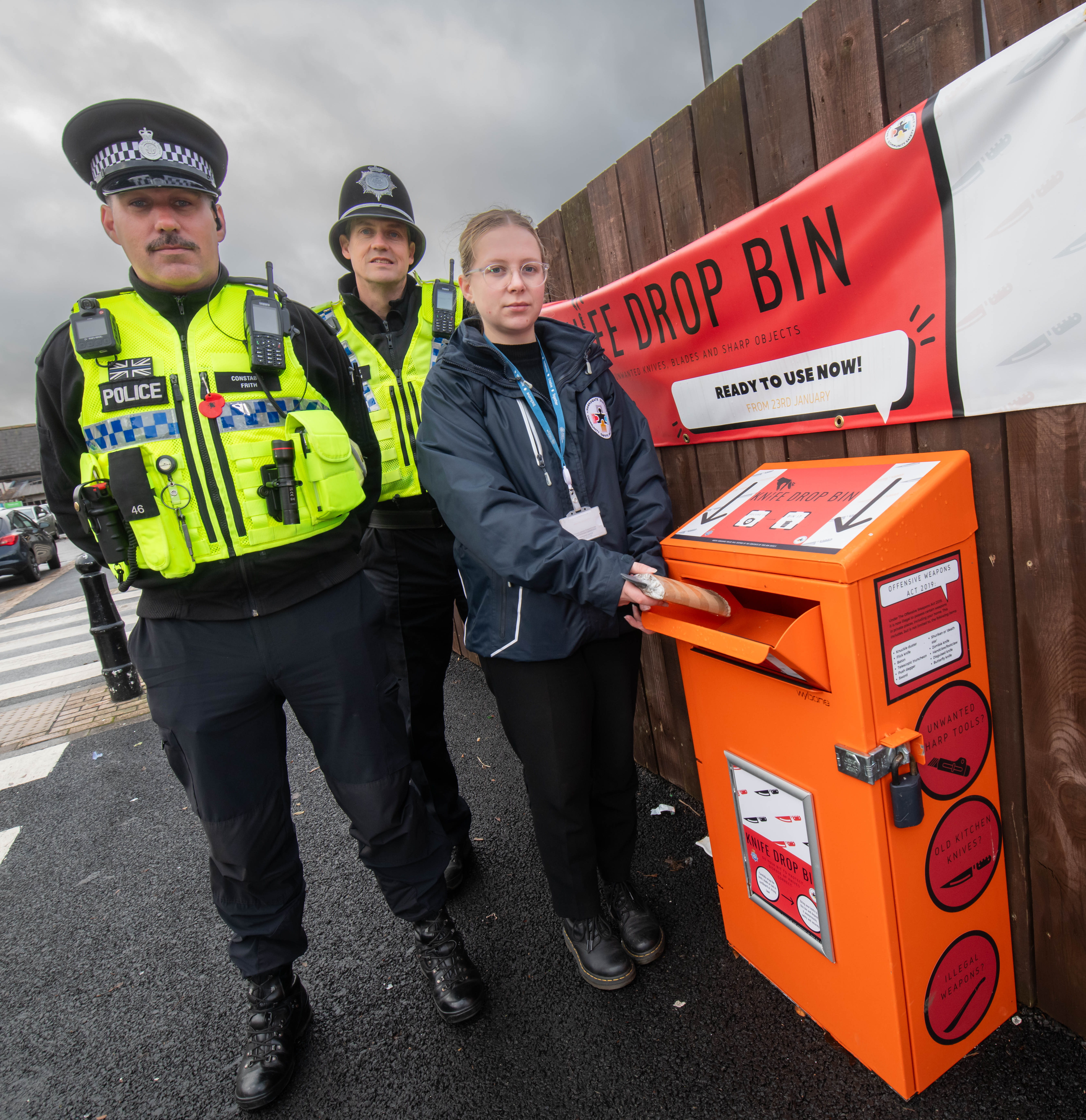 Community safety officer, Evie Griffiths, with North Yorkshire Police officers, PCs Kelvin Troughton and Brendon Frith, at the knife drop bin in Harrogate
