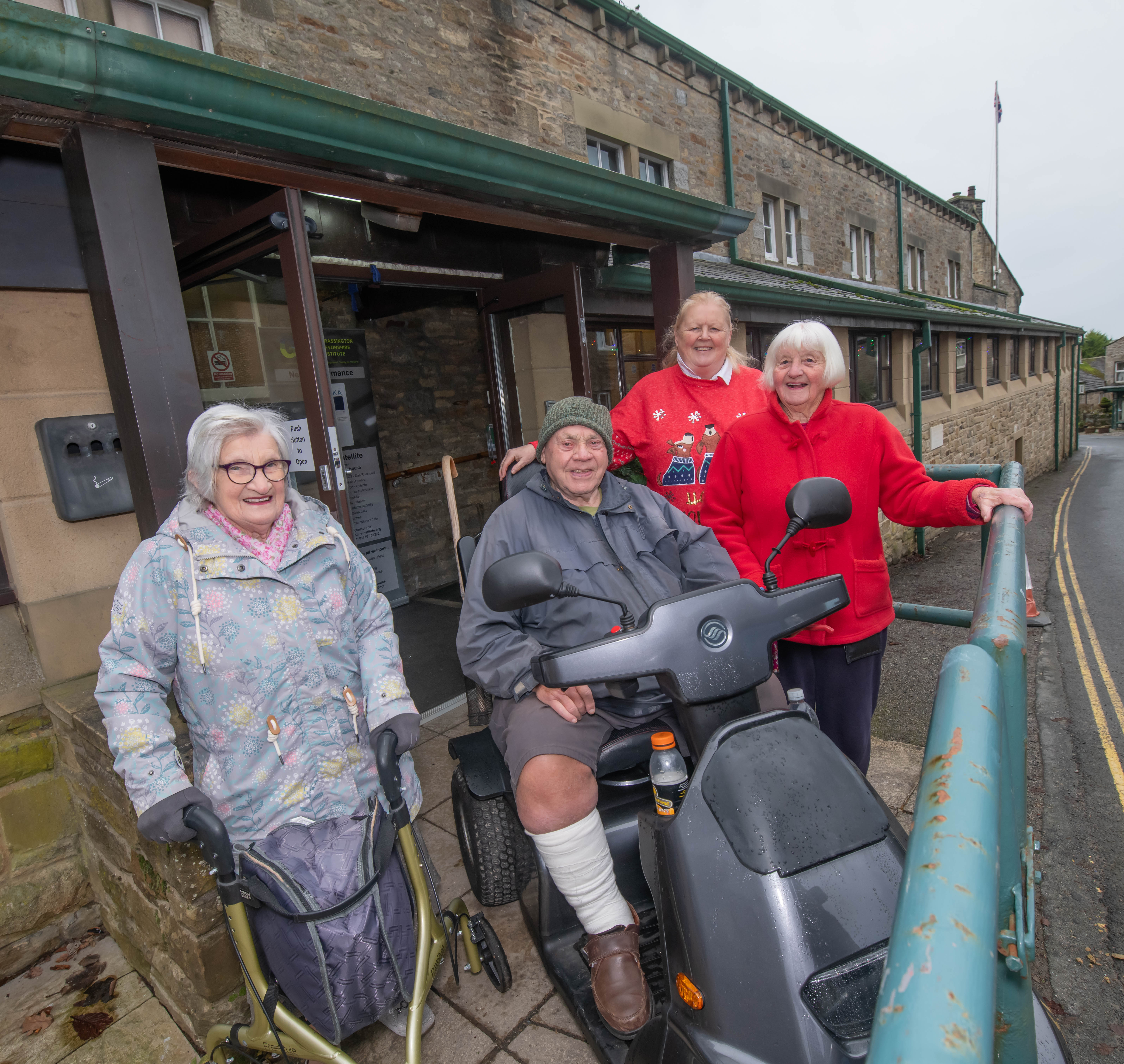 Rose Mary Baxter, Burke Smith, Hazel Drew and Jean Rowley outside the new accessible doors at Grassington Town Hall.