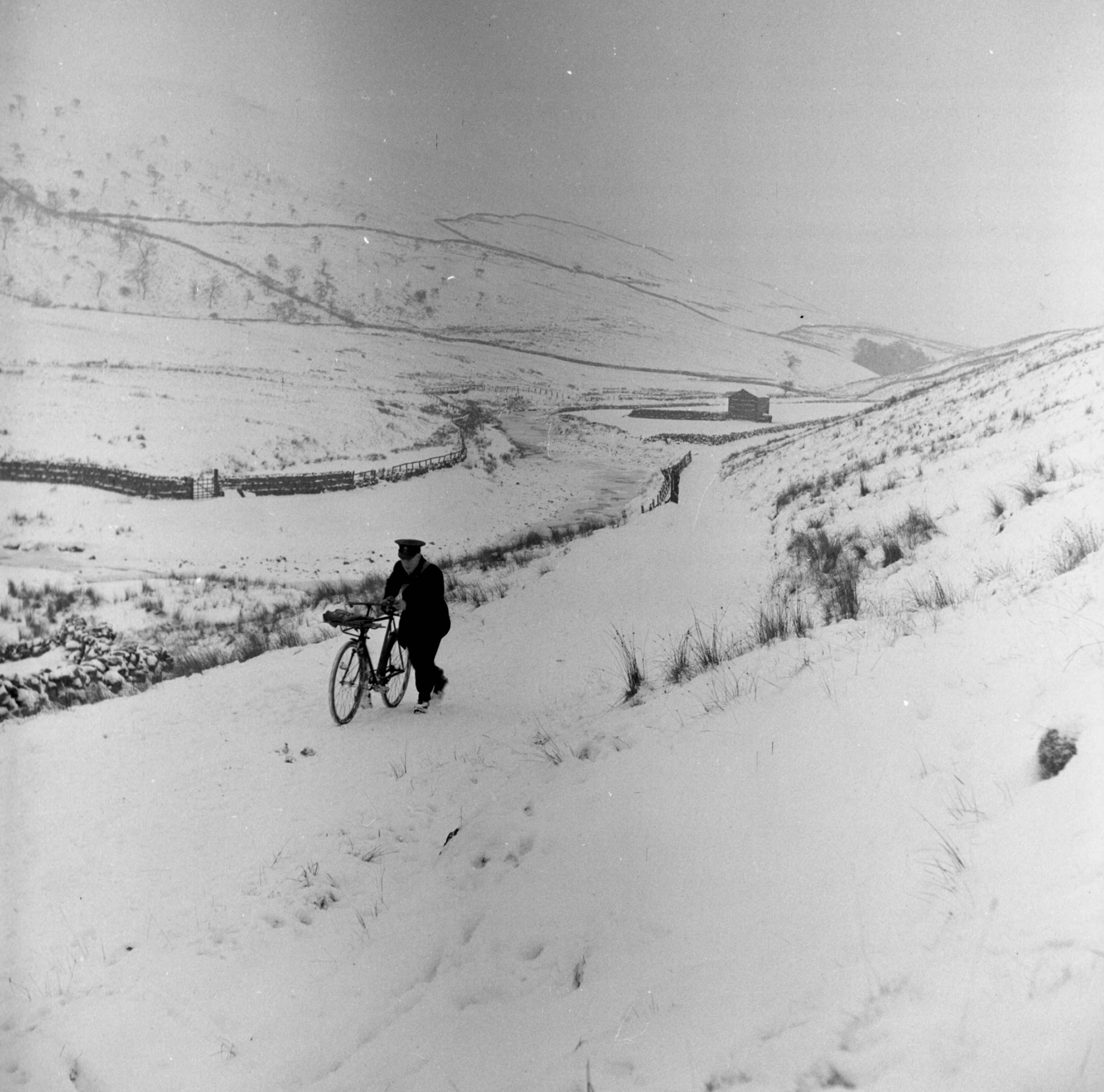 A Hawes district postman on his rounds, Cotterdale.