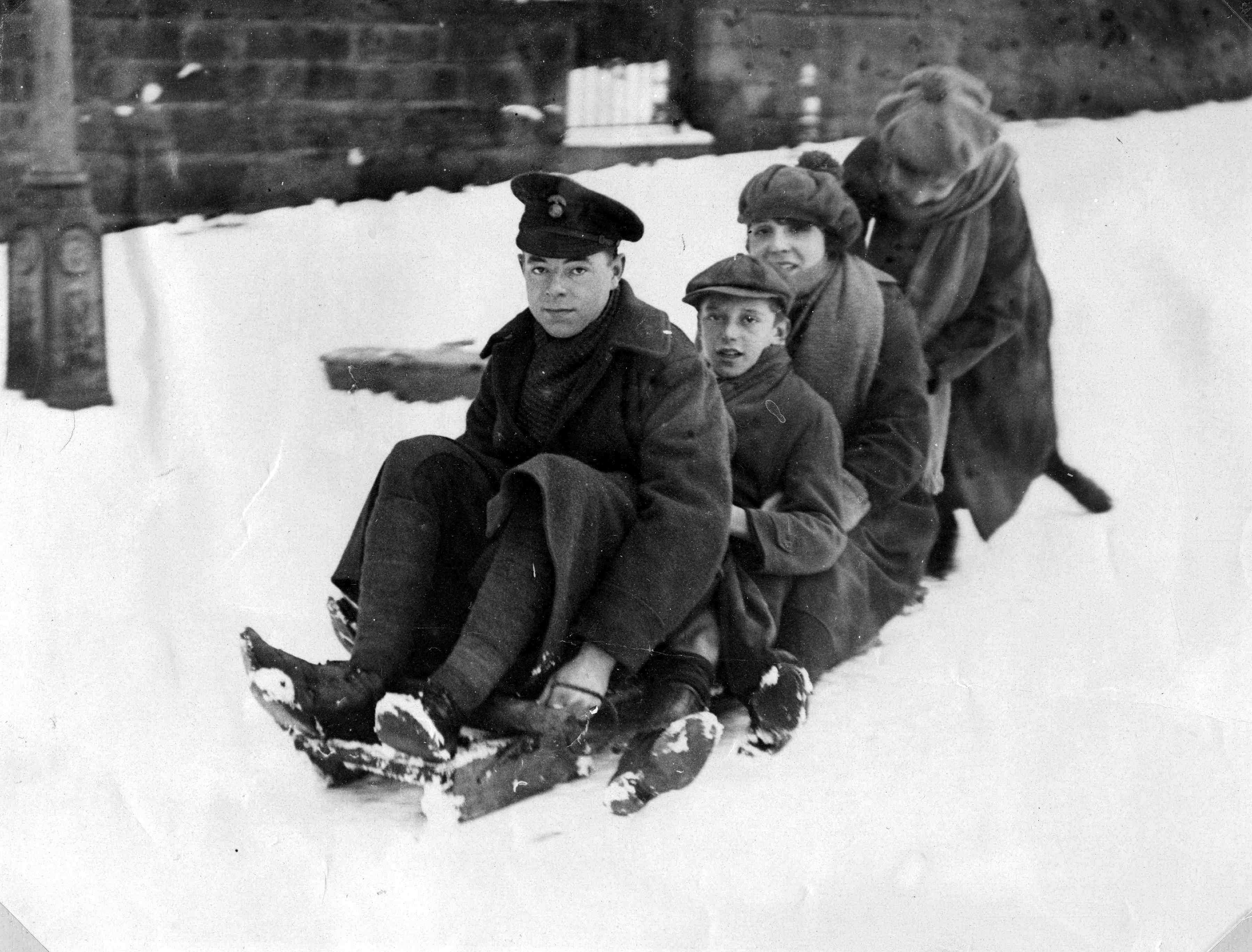 Children tobogganing in Harlow Moor Drive, Harrogate.