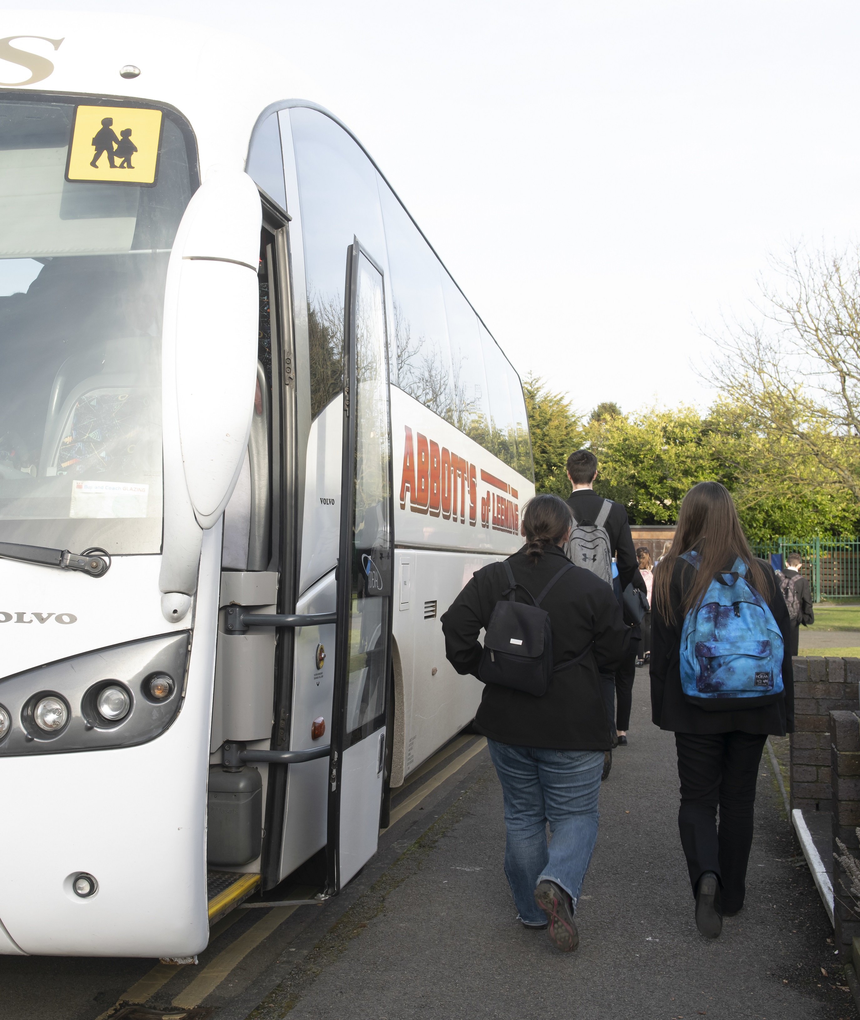 Children getting on a bus