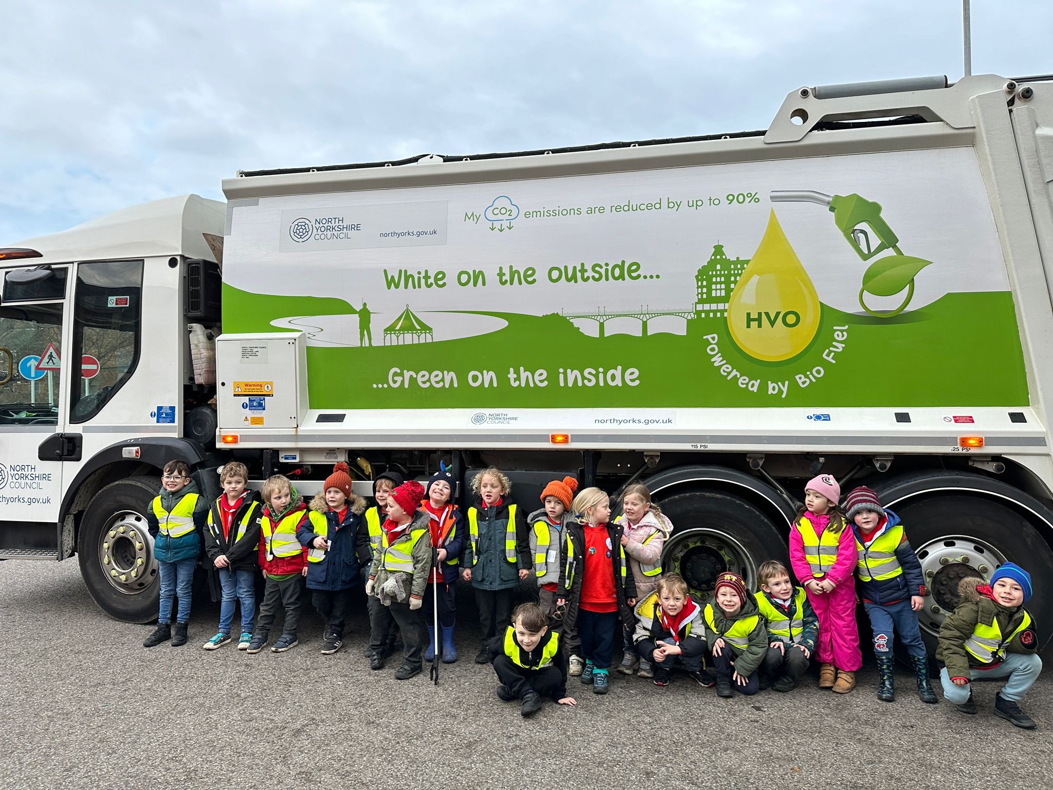 A scout group with a bin lorry