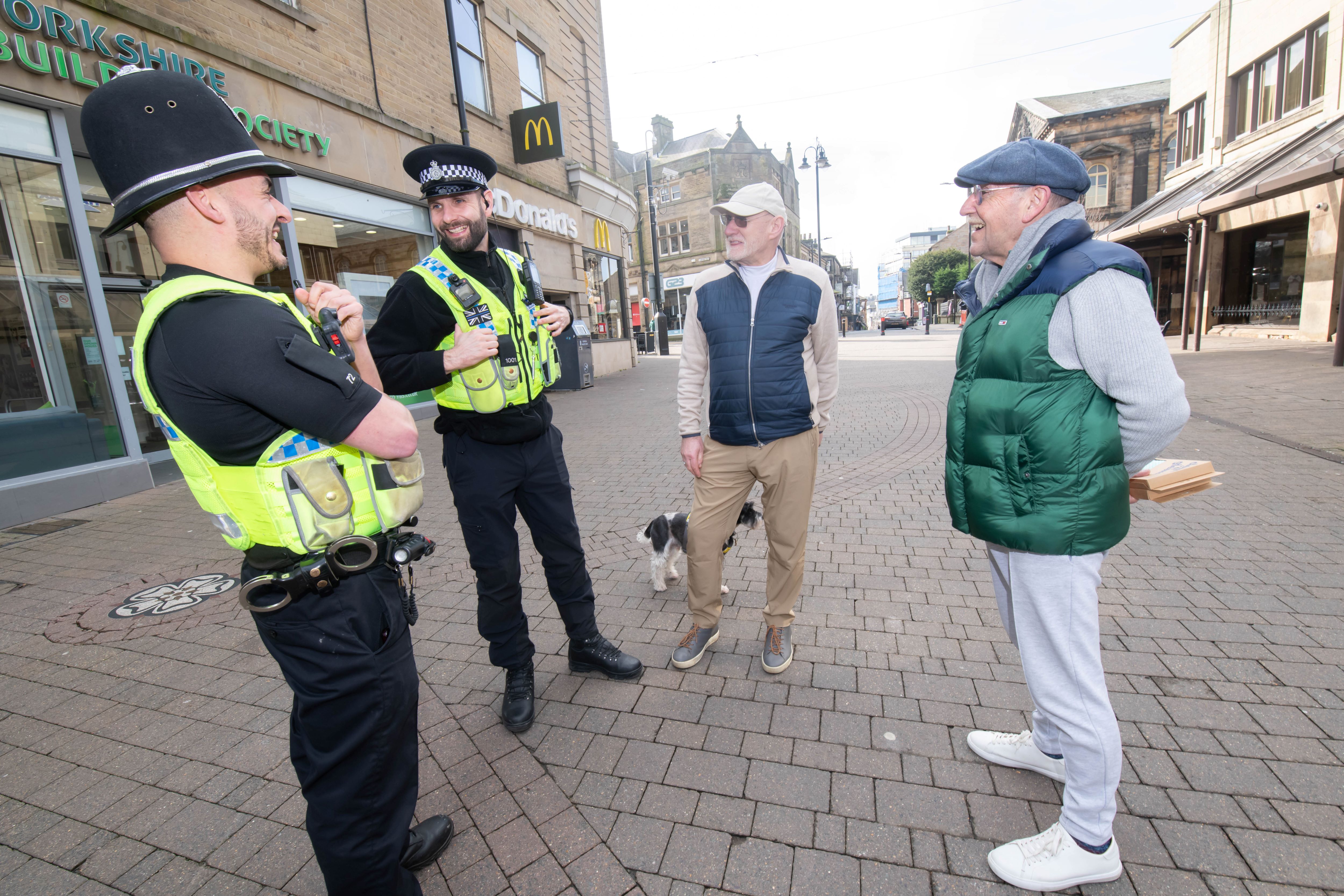 Operation Spotlight - four people talking in the centre of Harrogate