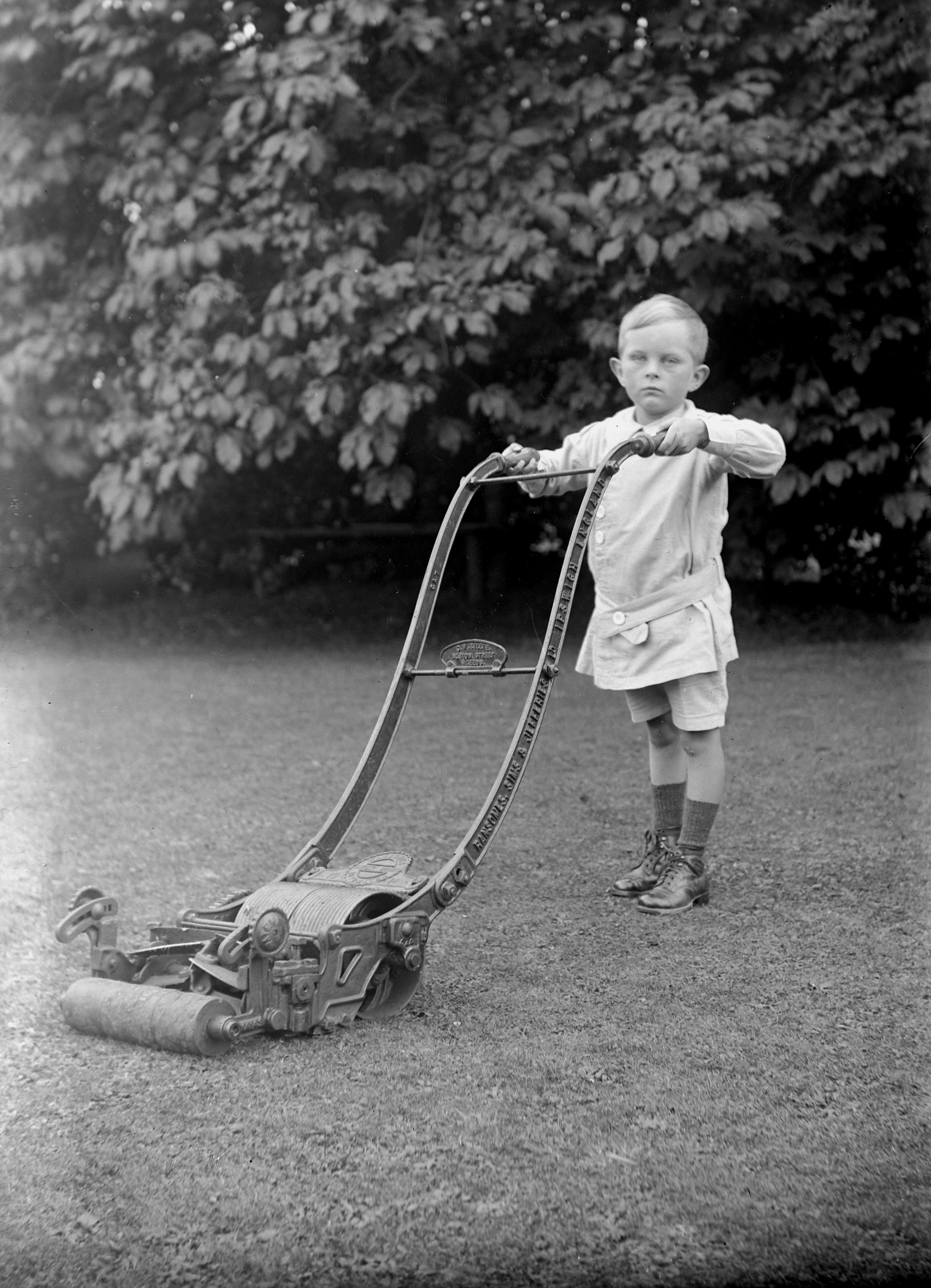 Bobbie with a Ransomes Sims and Jefferies lawnmower, Lower Dunsforth, circa 1917.  From a collection of photographs by local amateur photographer Louisa Kruckenberg.
