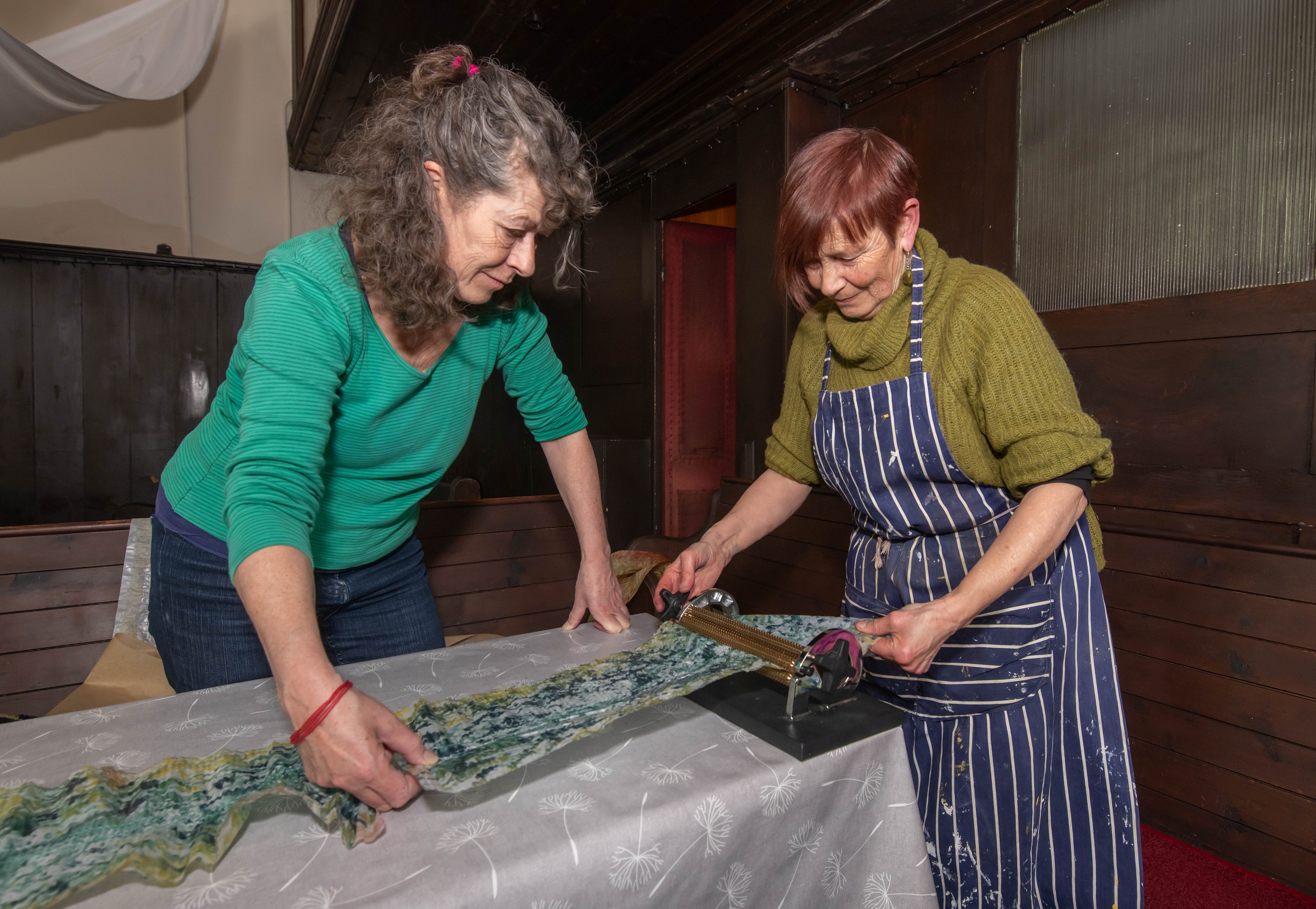 Sarah Priestley, left, and Viv Mousdell work on an arts project as part of The Living on the Edge of the World festival in Whitby.