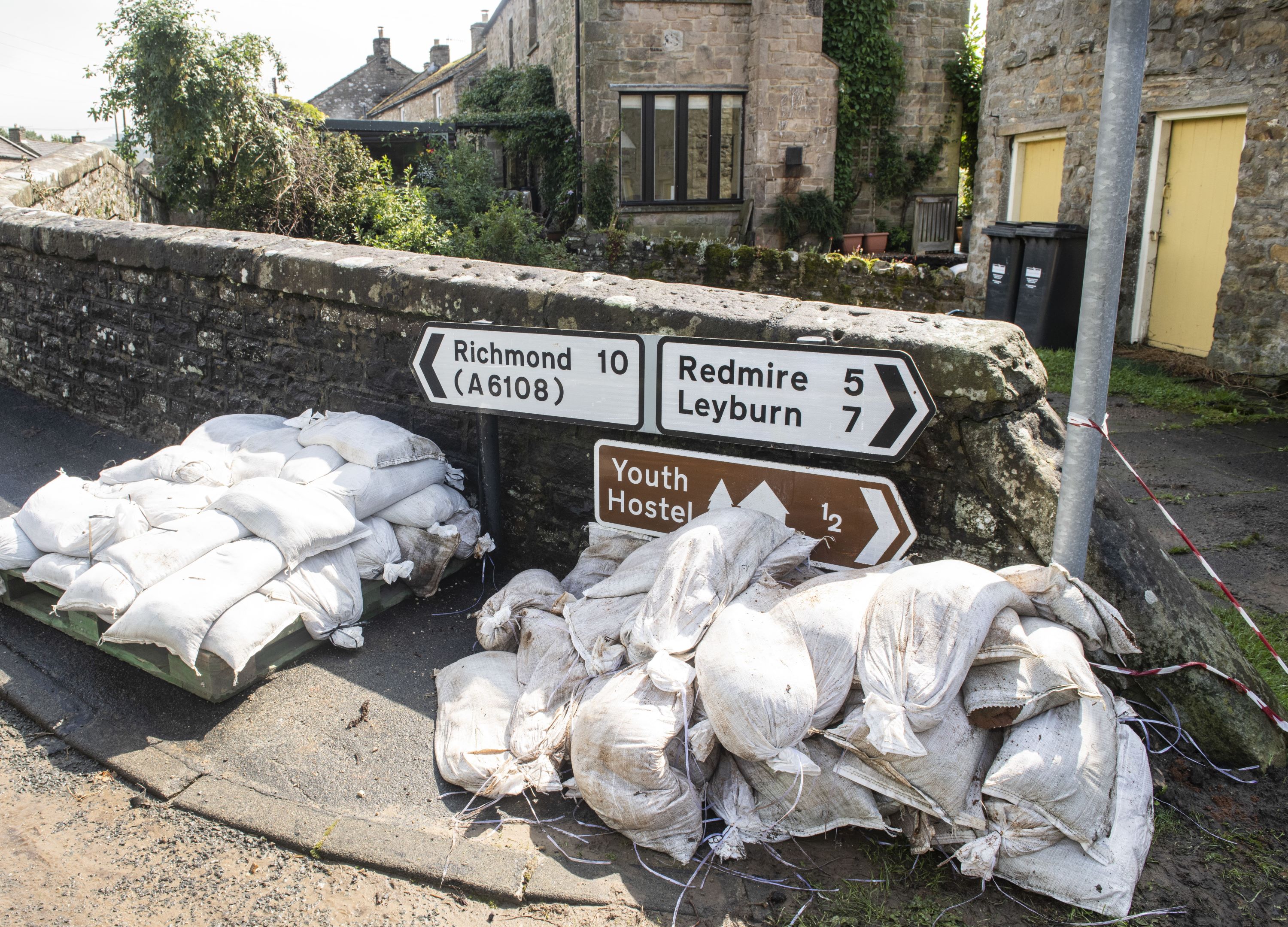 Sand bags near signs