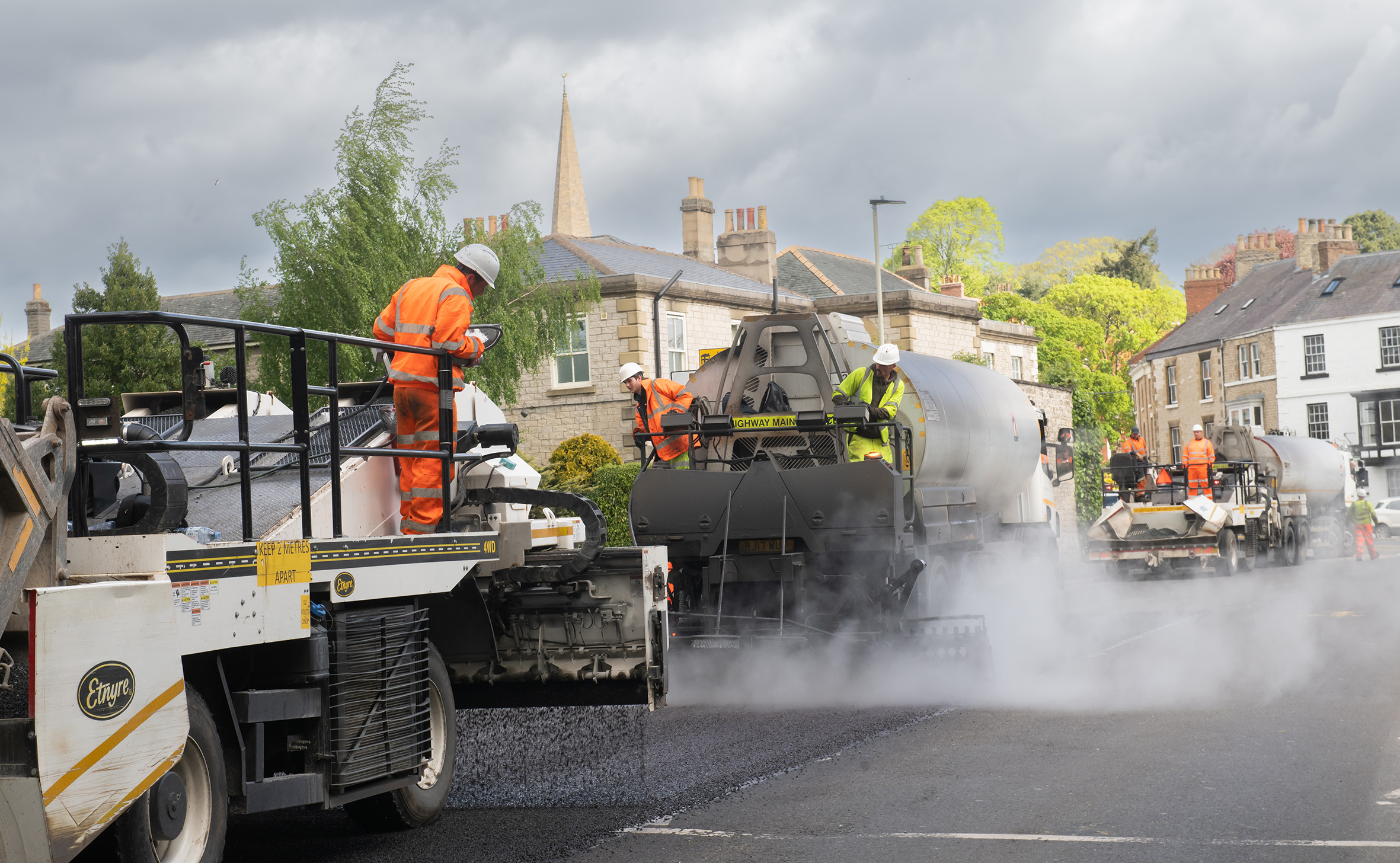 Highways team using a machine to carry out surface dressing